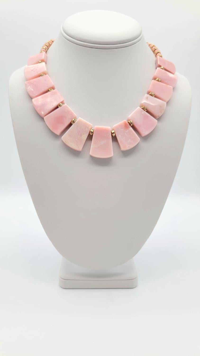 This one-of-a-kind necklace is a true delight for lovers of pink hues and opal gemstones. These stunning opals exhibit a range of hues, from soft blush to deep rose, creating a mesmerizing visual effect that is both elegant and modern.

The opal