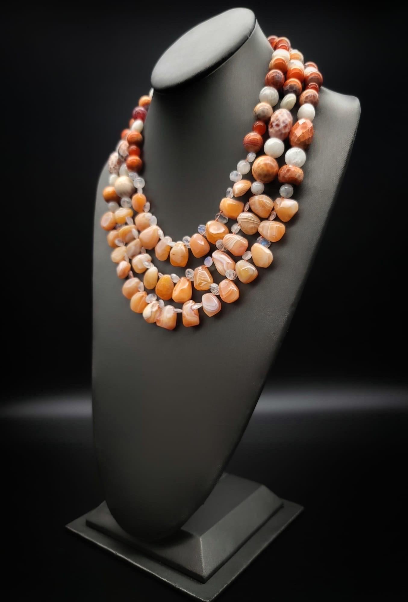 One-of-Kind

Return to the 60's vibe with this 3-strand bohemian statement necklace. A stunning mix of apricot Carnelian, Moonstone, Mexican Opal (rough cut nuggets as well as-polished beads ), and moonstones     
(polished or teardrop )The entire