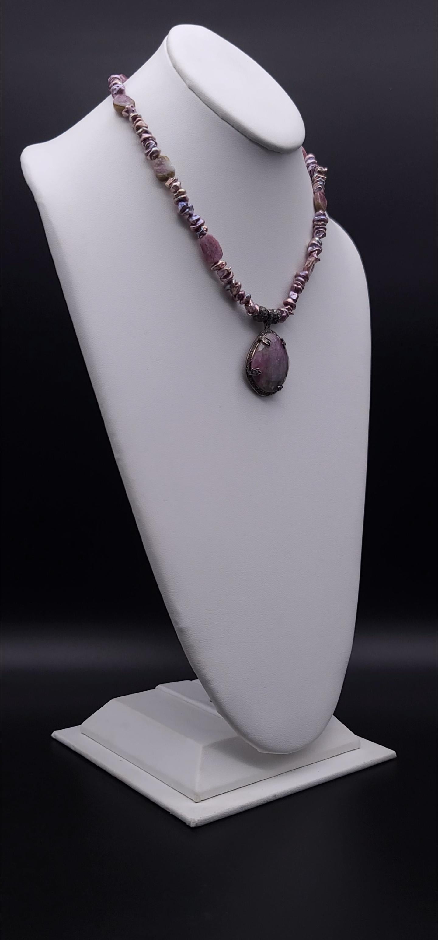 One-of-a-Kind

Indulge in the understated elegance of this Dusky Pink Tourmaline Pendant, featuring a stunning set of four dazzling diamonds that glisten and sparkle with every movement. The pendant is gracefully suspended from a delicate chain,