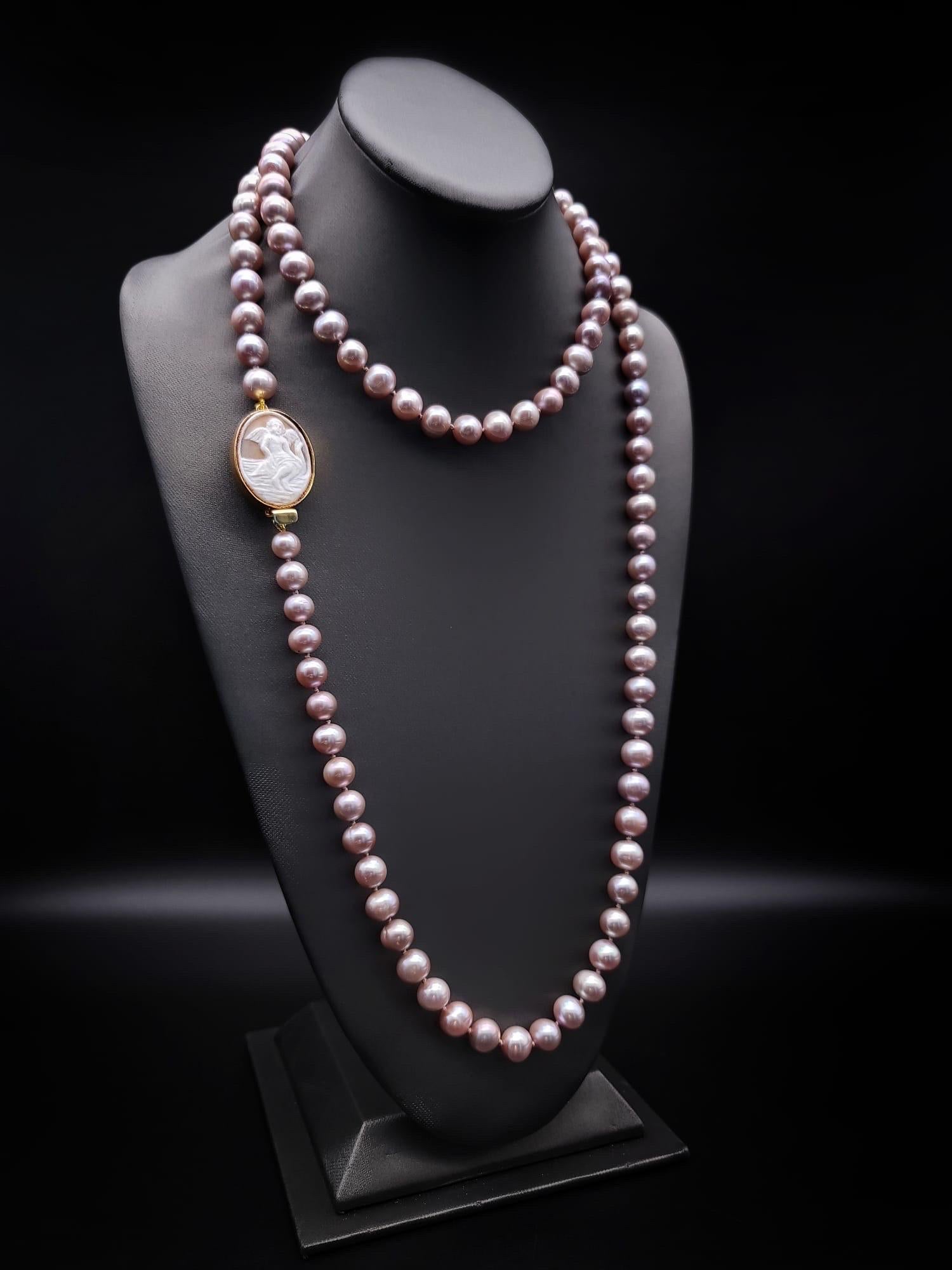 One-of-a-Kind

Spectacular Angel Skin Pink Freshwater Pearl necklace breathes timeless indulgence into an opulently distinctive design inspired by the past. Extremely versatile around 50 inches in rope length, anchored with a  vintage Italian cameo