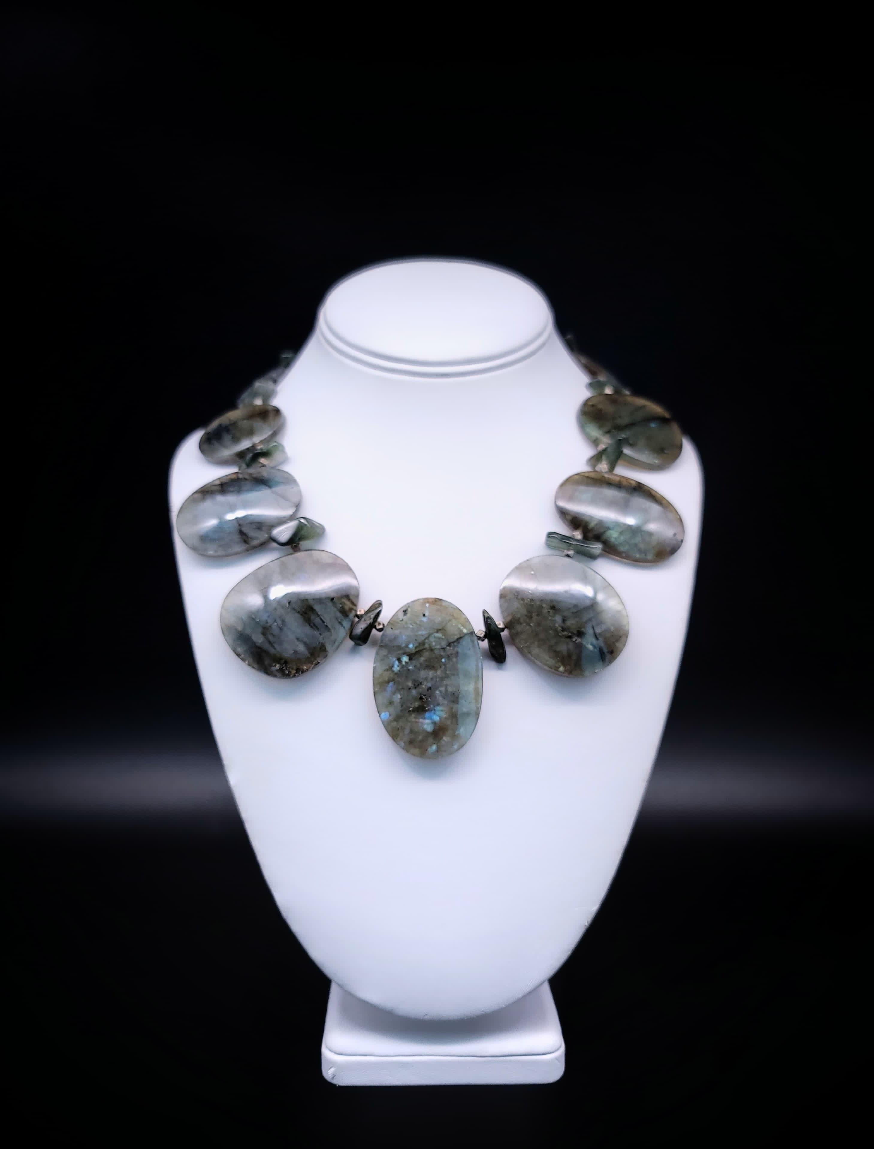 Step into a world of unparalleled glamour with our extraordinary necklace, a symphony of opulence and elegance. Behold the enchanting Labradorite Drop round shape plates, each radiating a mesmerizing aura, accompanied by a lavish spacer nugget of