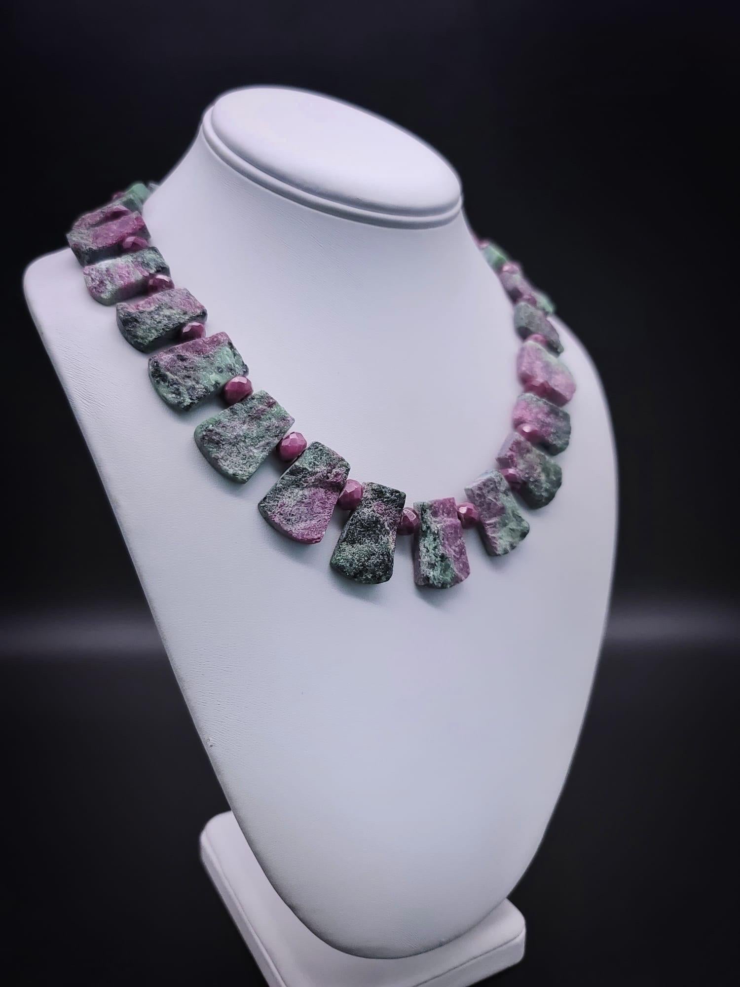 One-of-a-Kind Ruby Zoisite Collar: A Fusion of Rarity and Spiritual Elegance!

This remarkable collar showcases the allure of nature's unique beauty, crafted with uniform rough-cut Ruby Zoisite stones, each carefully polished on the backside to