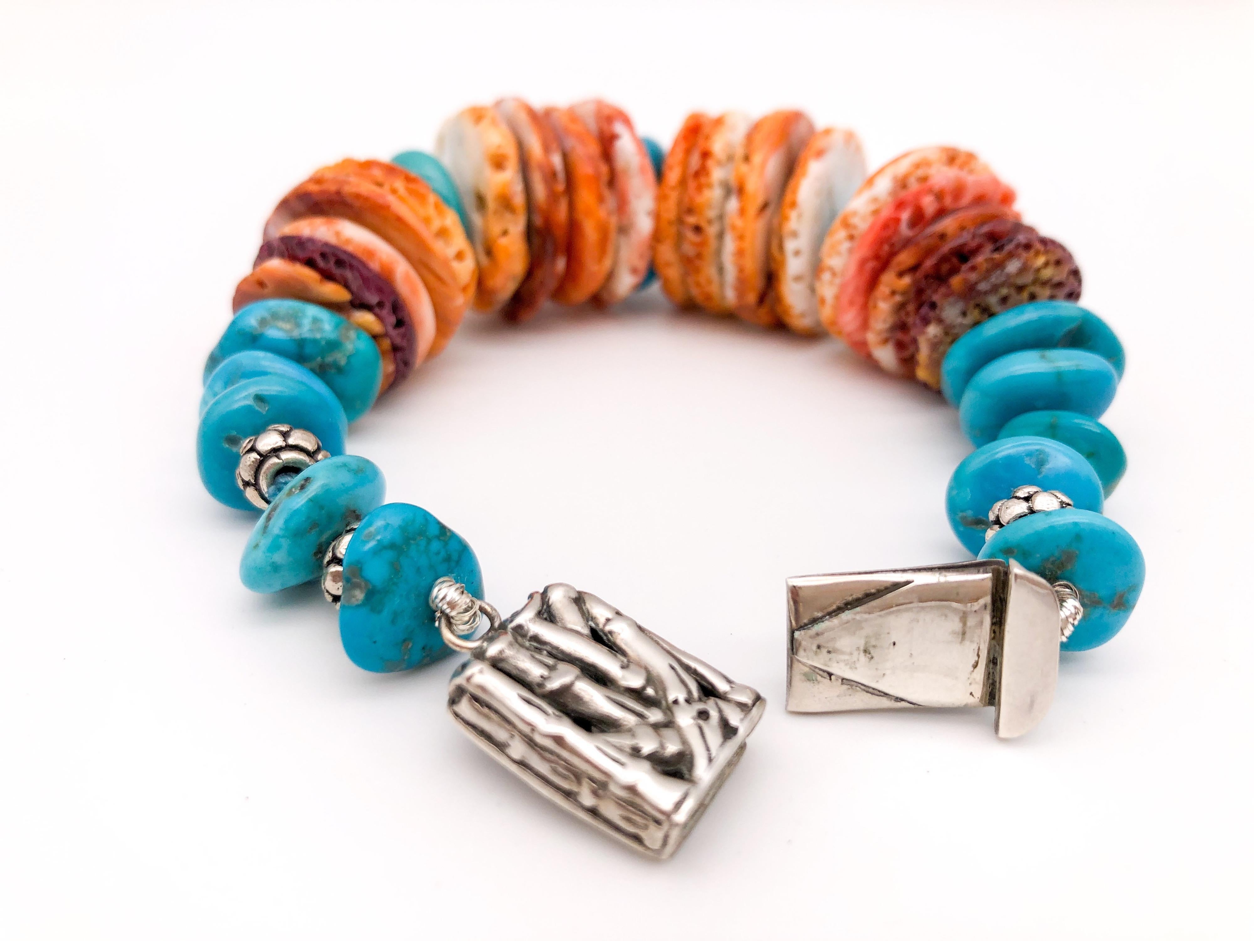One-of-a-Kind
This round shape Spiny Oyster shell bracelet has been tastefully designed with a splash of Turquoise spacers and a Sterling Silver clasp. 
Turquoise is the birthstone of December. It is believed that turquoise tends to bring good
