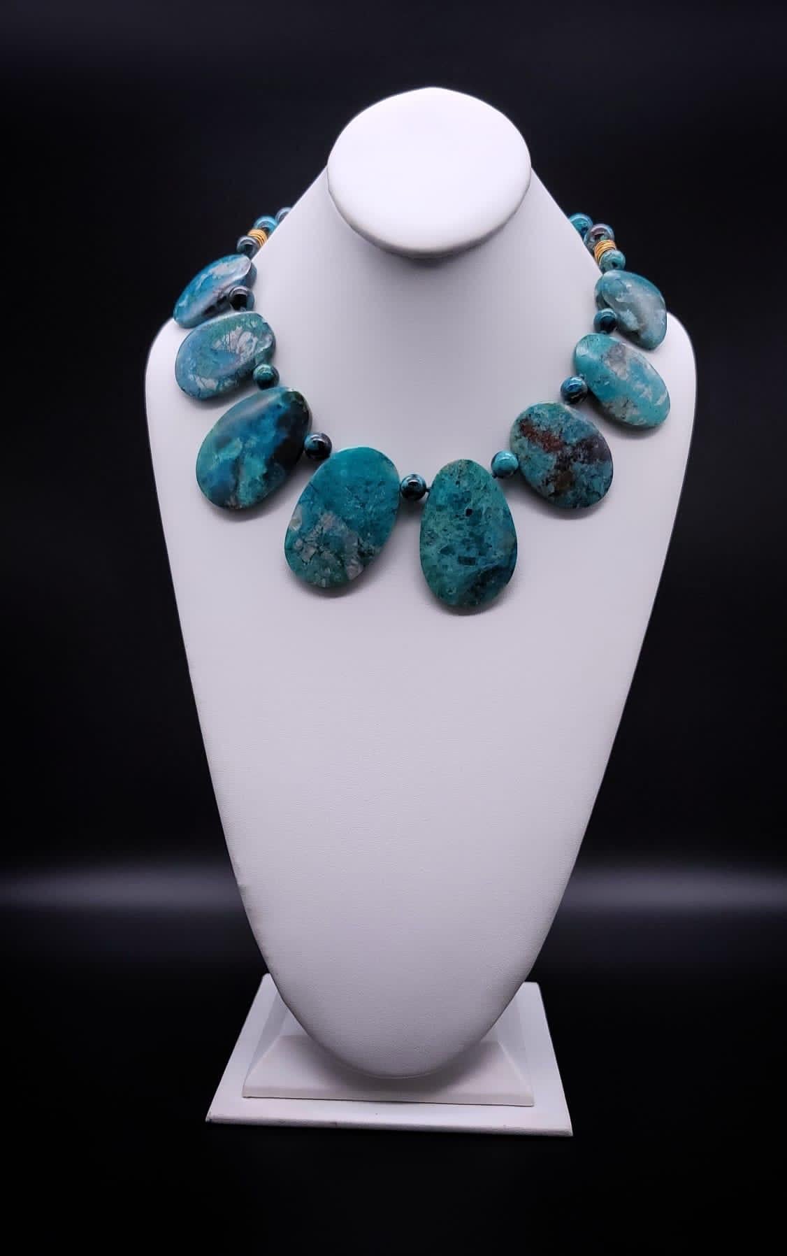 One-of-a-Kind

Powerful necklace of natural, specimen blue/green Chysacola plates. The highly polished stones are separated by 10 m.m Chysacola polished beads. Flat stones set this piece apart from the convention of big statement necklaces. This