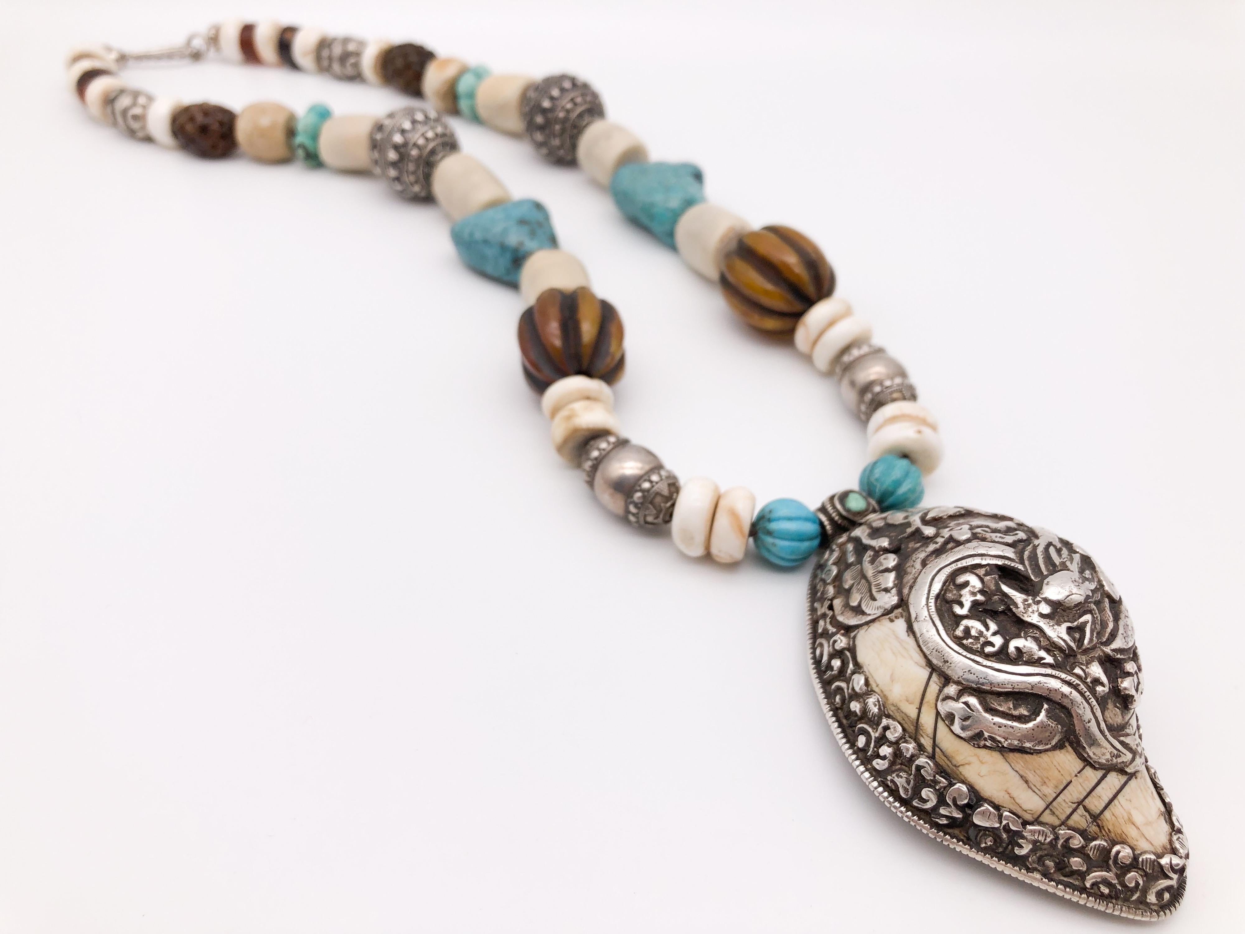 One-of-a-Kind
This amazing Bold pendant necklace is truly exquisite! 
 It features an intricate Dragon carved design on a beautiful bone and Sterling Silver pendant from Tibet. 