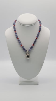 A.Jeschel Sterling silver Scarab supended from an Iolite and coral necklace
