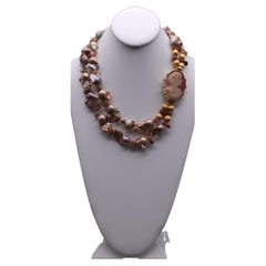 A.Jeschel Stunning Gold Baroque Pearl necklace with an Italian cameo side clasp.