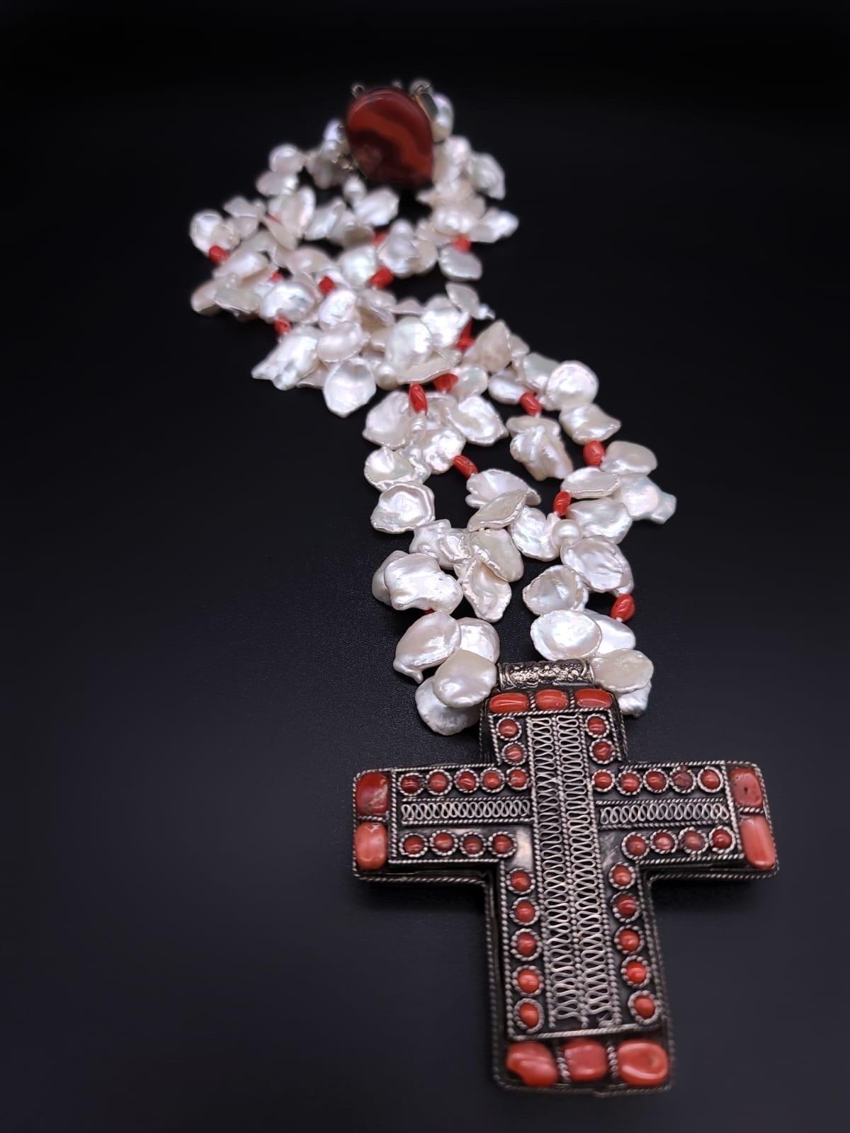 Contemporary A.Jeschel Stunning Keshi Pearl necklace with silver cross pendant. For Sale