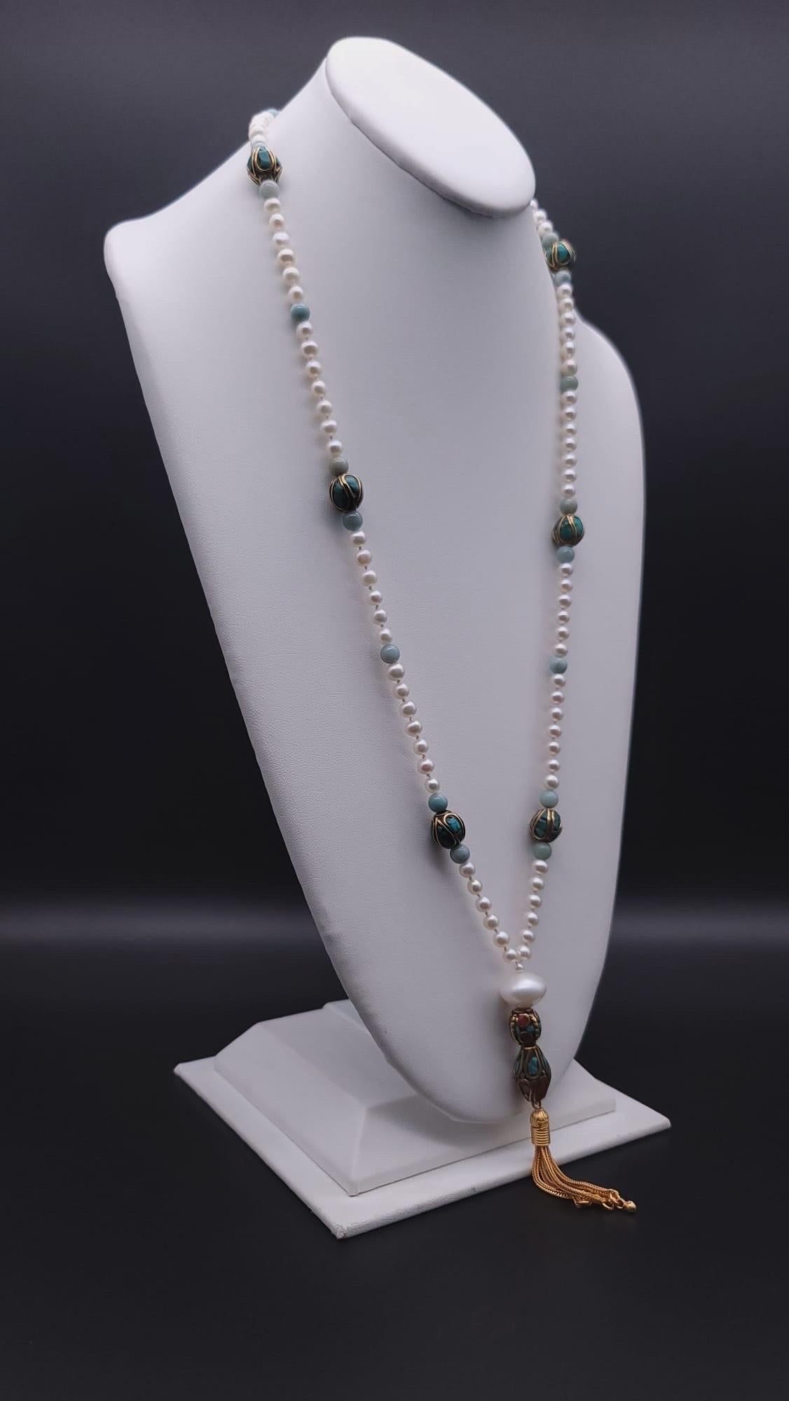 One-of-a-Kind

Who says simple has to be boring? 

Turquoise and bits of coral painstakingly inlaid into Tibetan beads are surrounded by small well -matched 5mm Freshwater Pearls. Those, in turn, are guarded by subtly colored Amazonite polished