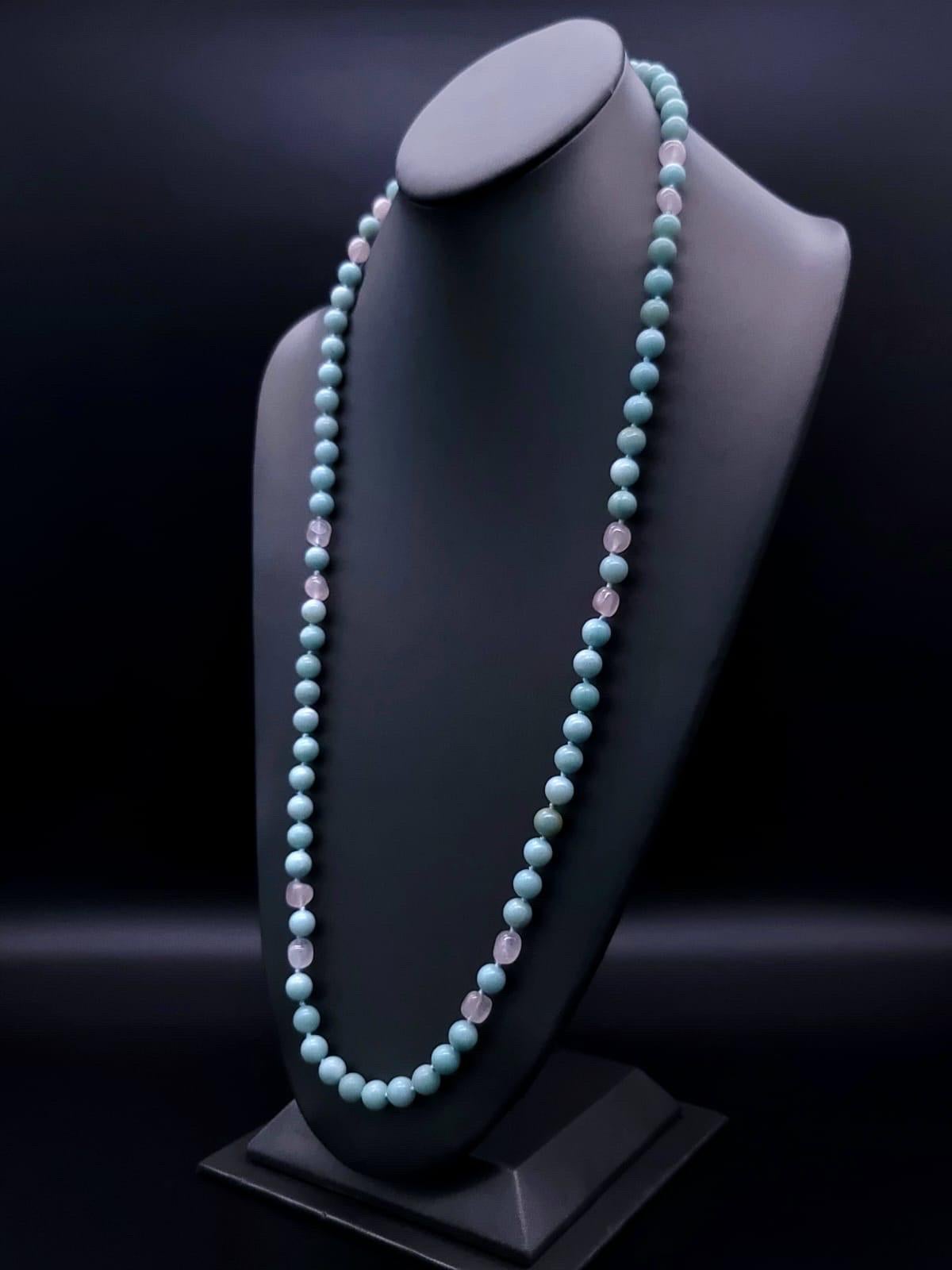 One-of-a-Kind

Pastel 8m.m Amazonite and Rose Quartz in a long (48”)strand with polished Rose Quartz cabochon clasp offers maximum versatility. Wear the strand as one long dramatic necklace or double up into a conventional two-strand necklace. Or go