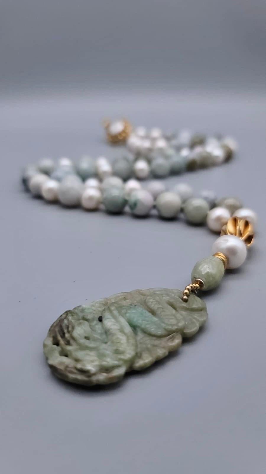 One-of-a-Kind

Dramatic long ( 34”) Jade necklace in a melange of  12mm Burma Jade beads accented with   Chinese celadon jade as well as 12mm pearls surrounding 14 mm carved celadon longevity beads set at intervals along the strand. The necklace is