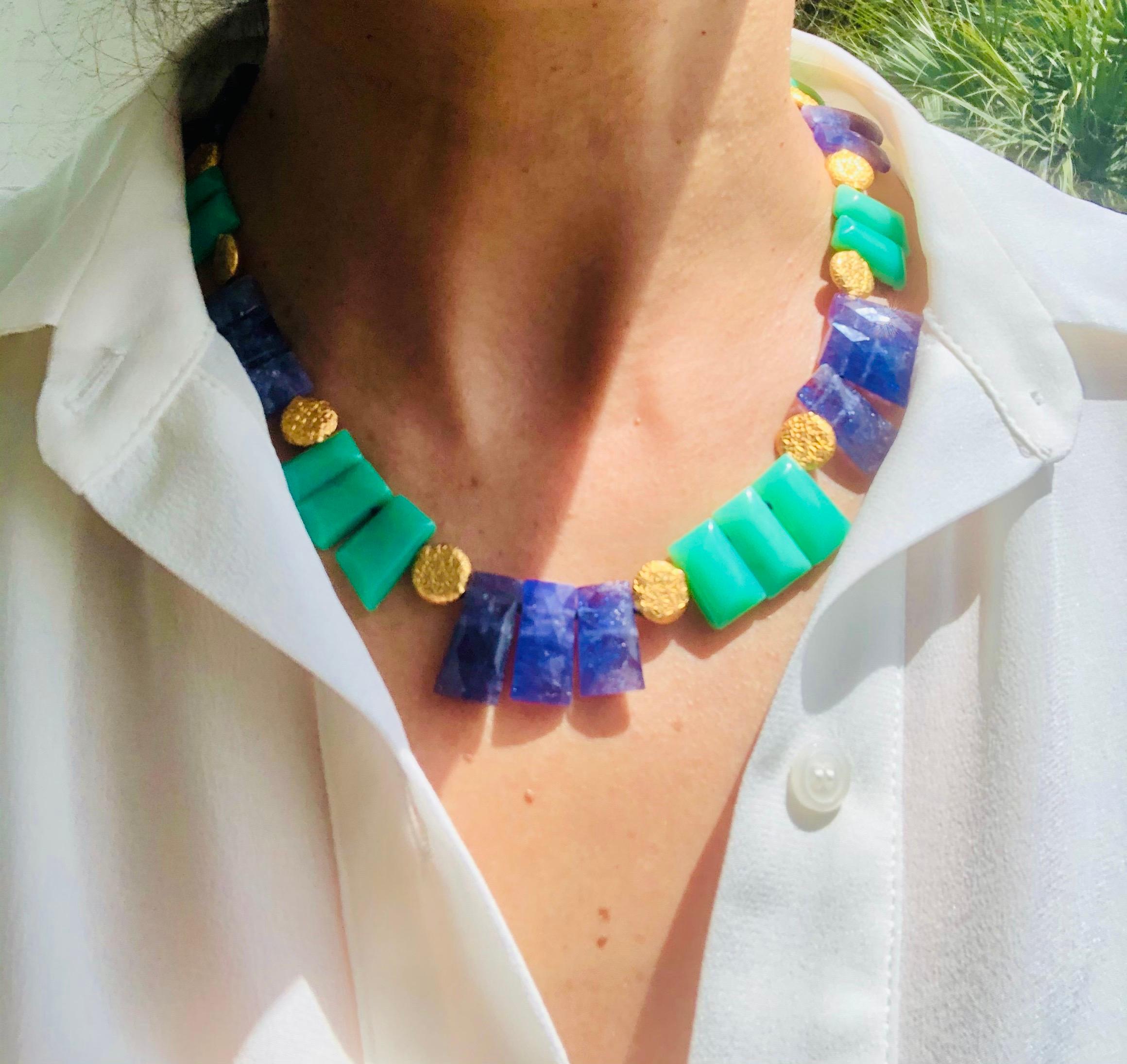 One-of-a-Kind

Brilliant blue and green stones, of such clarity, that it is hard to believe that they were once raw stones. Set into a handsome collar separated by small embossed vermeil discs. The clasp is also embossed vermeil.
Gemstones Tanzanite