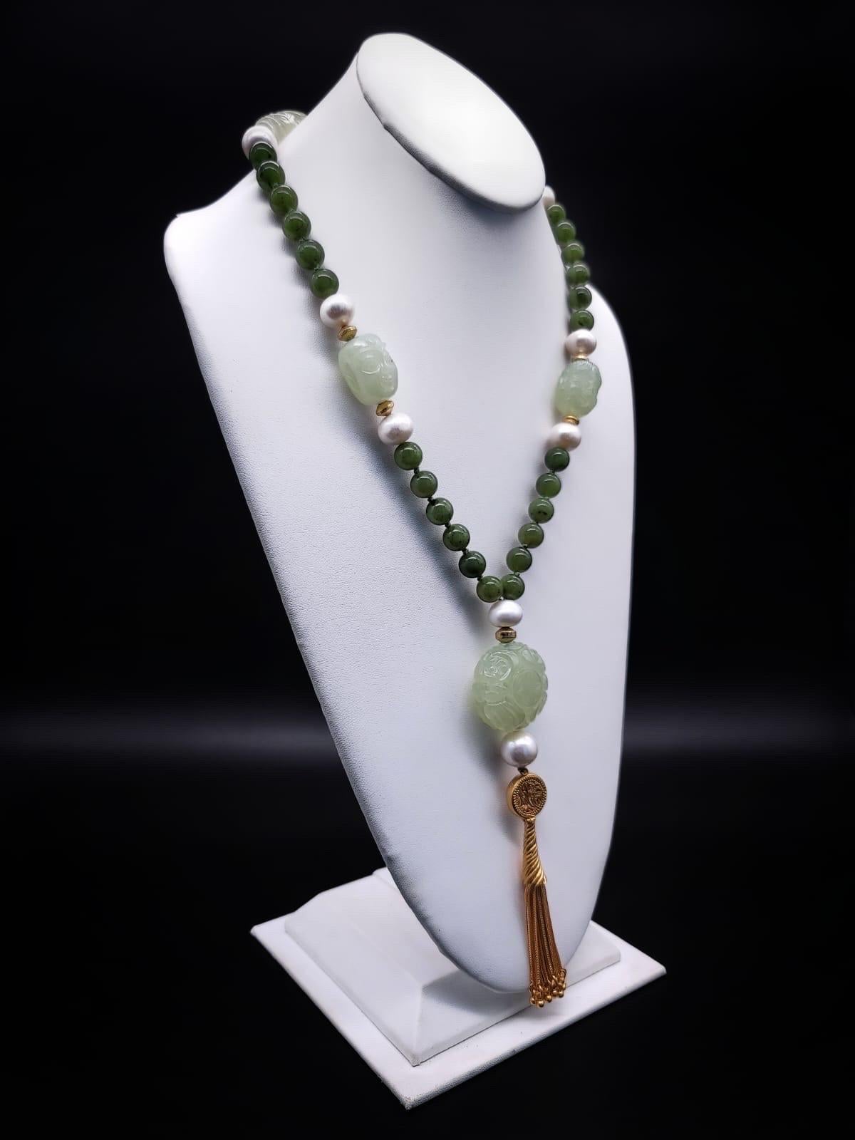 One-of-a-Kind

Jade, desired for its rich heritage, as well as for its beauty and durability, is showcased in a 40” rope of mixed Nephrite and Jadeite (both forms of Jade) as well as Pearls and vermeil.
The Nephrite Chinese carved beads are Shou