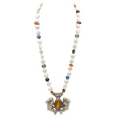 A.Jeschel Tibetan "Two Golden Fish" pendant on Freshwater Pearl necklace.
