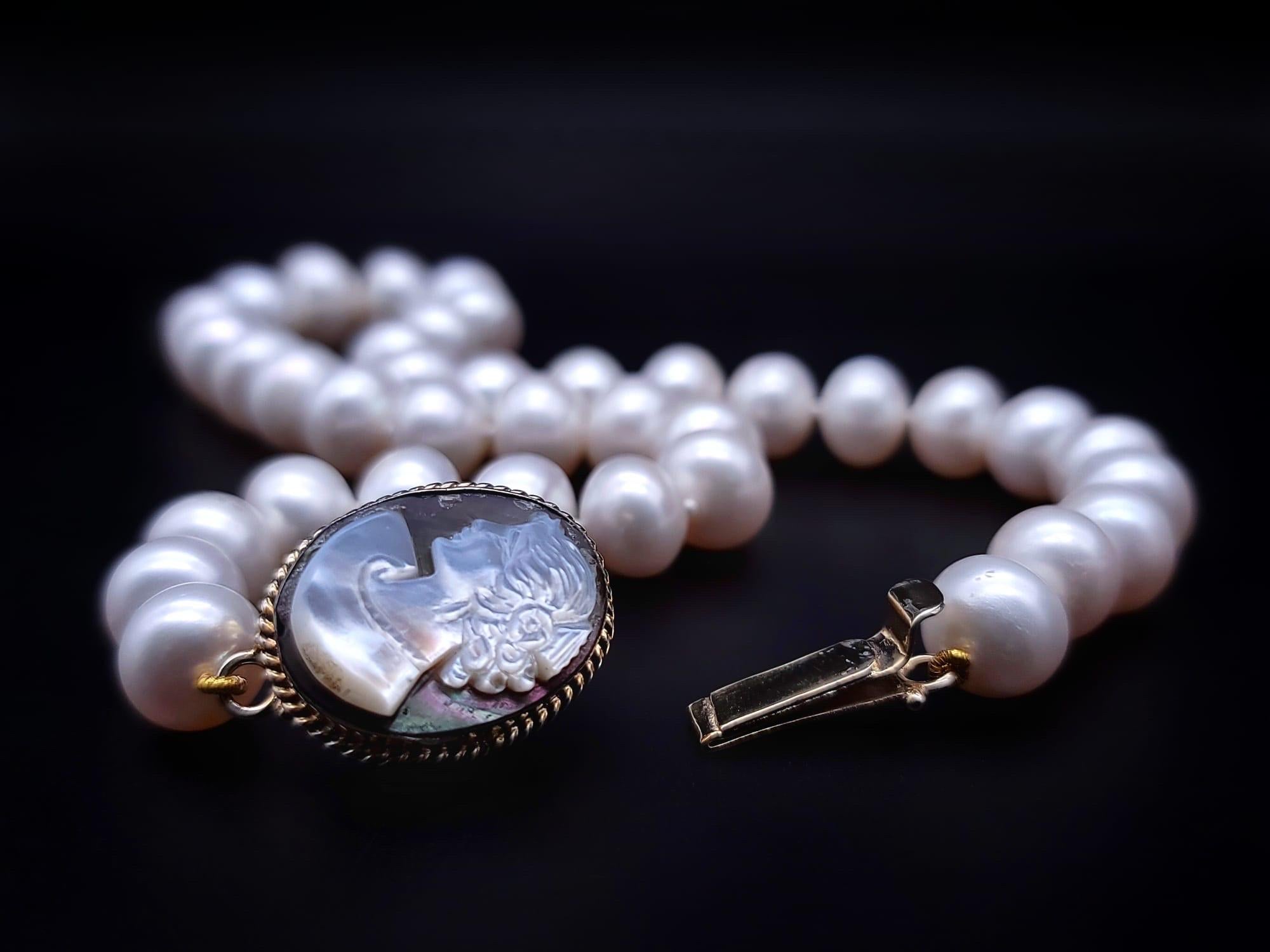 Women's or Men's A.Jeschel Timeless and elegant Freshwater Pearl and vintage Cameo necklace.