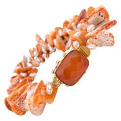 A.Jeschel - Deux brins  Bracelet coquille d'huître orange à pointes