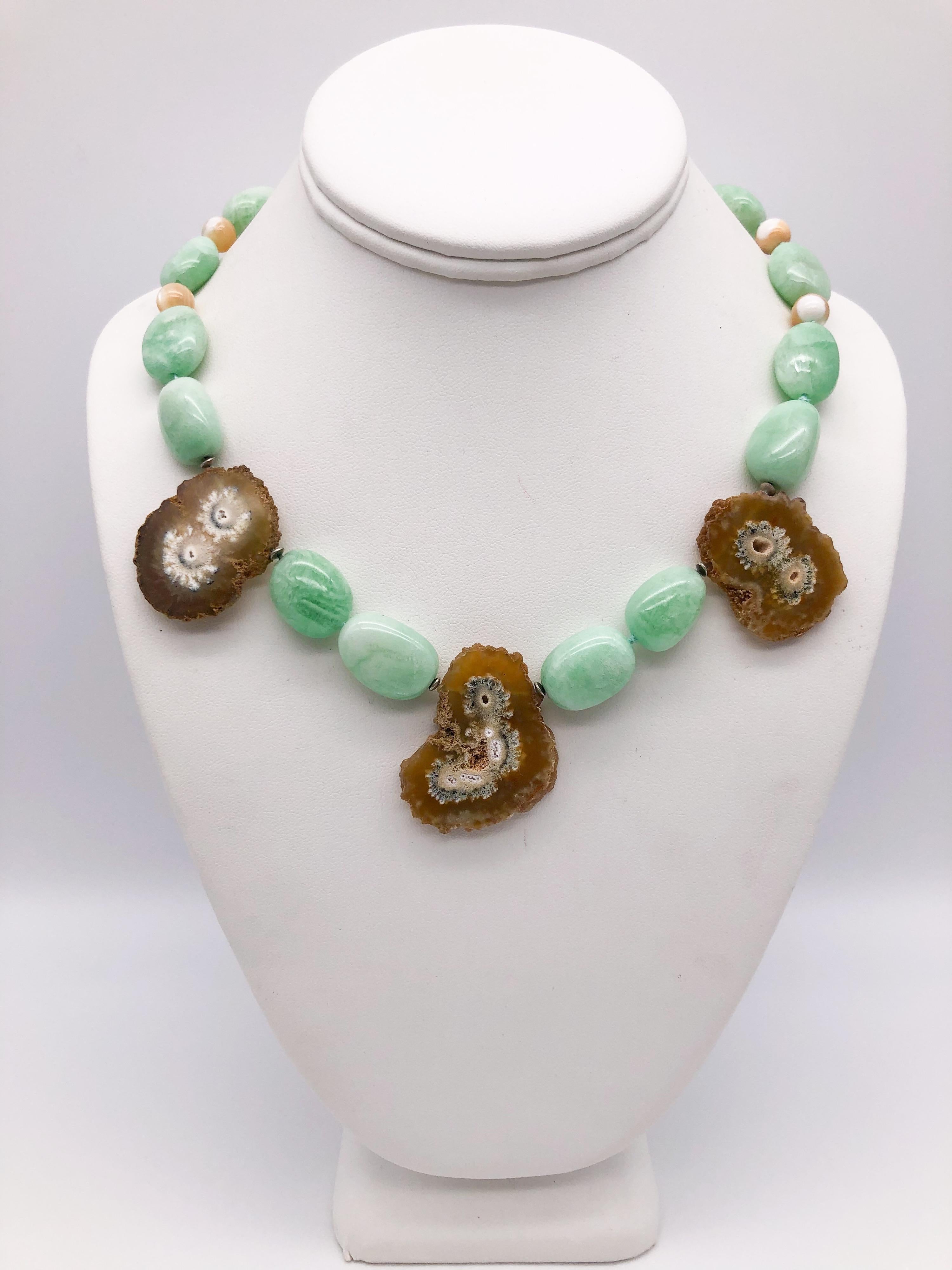 One-of-a-Kind
Soft as springtime pale green polished Amazonite nuggets pick up the tone of the green in the middle of each geode. The 3 geode slices appear to blossom between the beads. The small beads are moonstone, repeating the soft beige of the