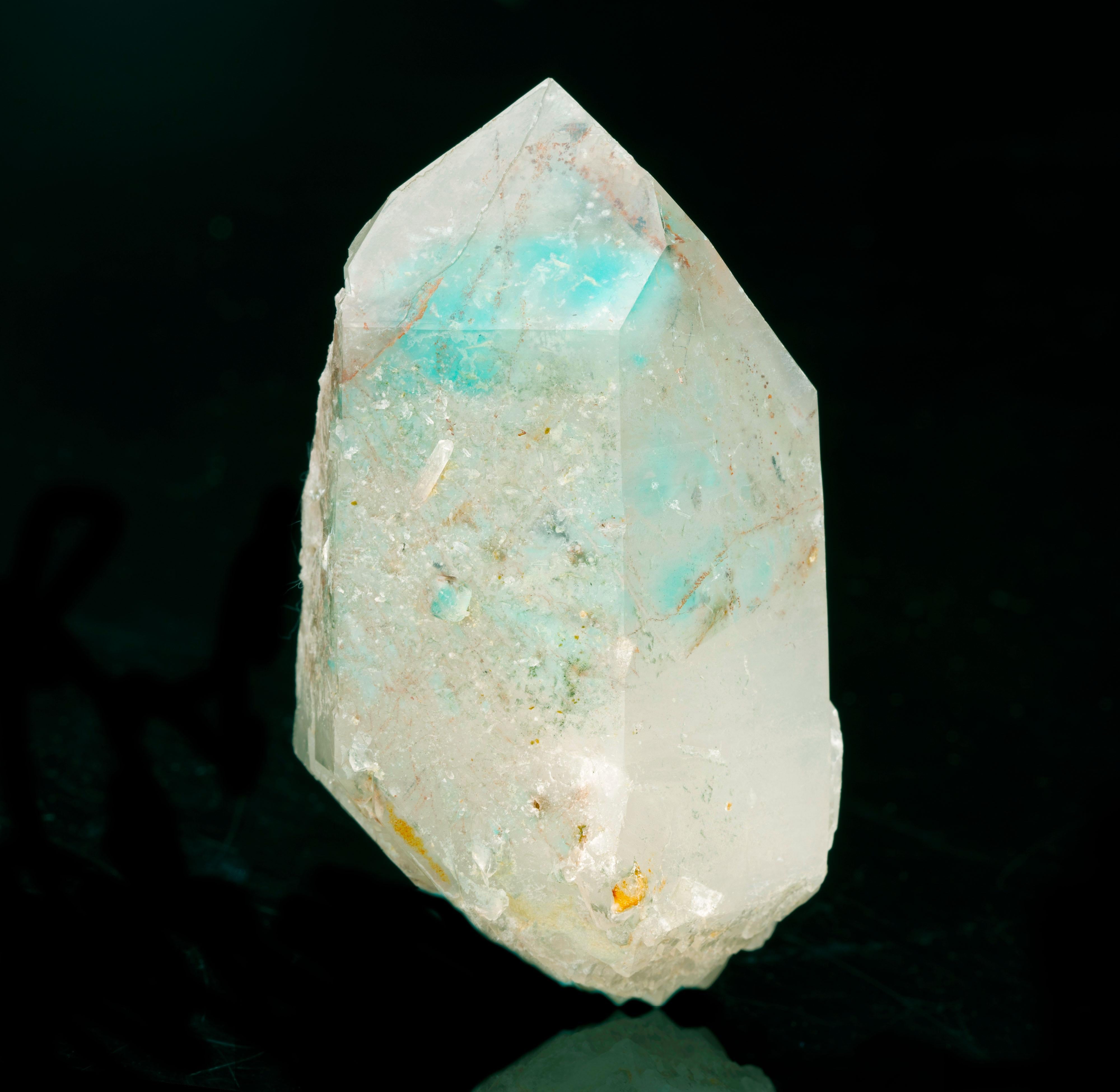 This rare and coveted specimen is a hefty ajoite-included unpolished quartz point from the famous location for these crystals in the Musina district of South Africa. Chrysocolla-included quartz is often passed off as coveted genuine specimens such