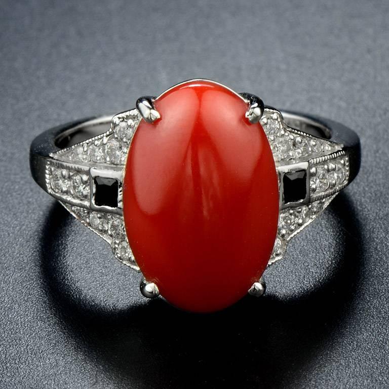 AKA Coral or Ox Blood Color Coral (Corallium Japonicum) from Japan weight 4.10 Carat set with French Cut Onyx 2 pieces 0.10 Carat and Brilliant Cut Diamond 20 pieces 0.21 Carat on the shoulders. 

This ring was made in 18k White Gold size US#7

