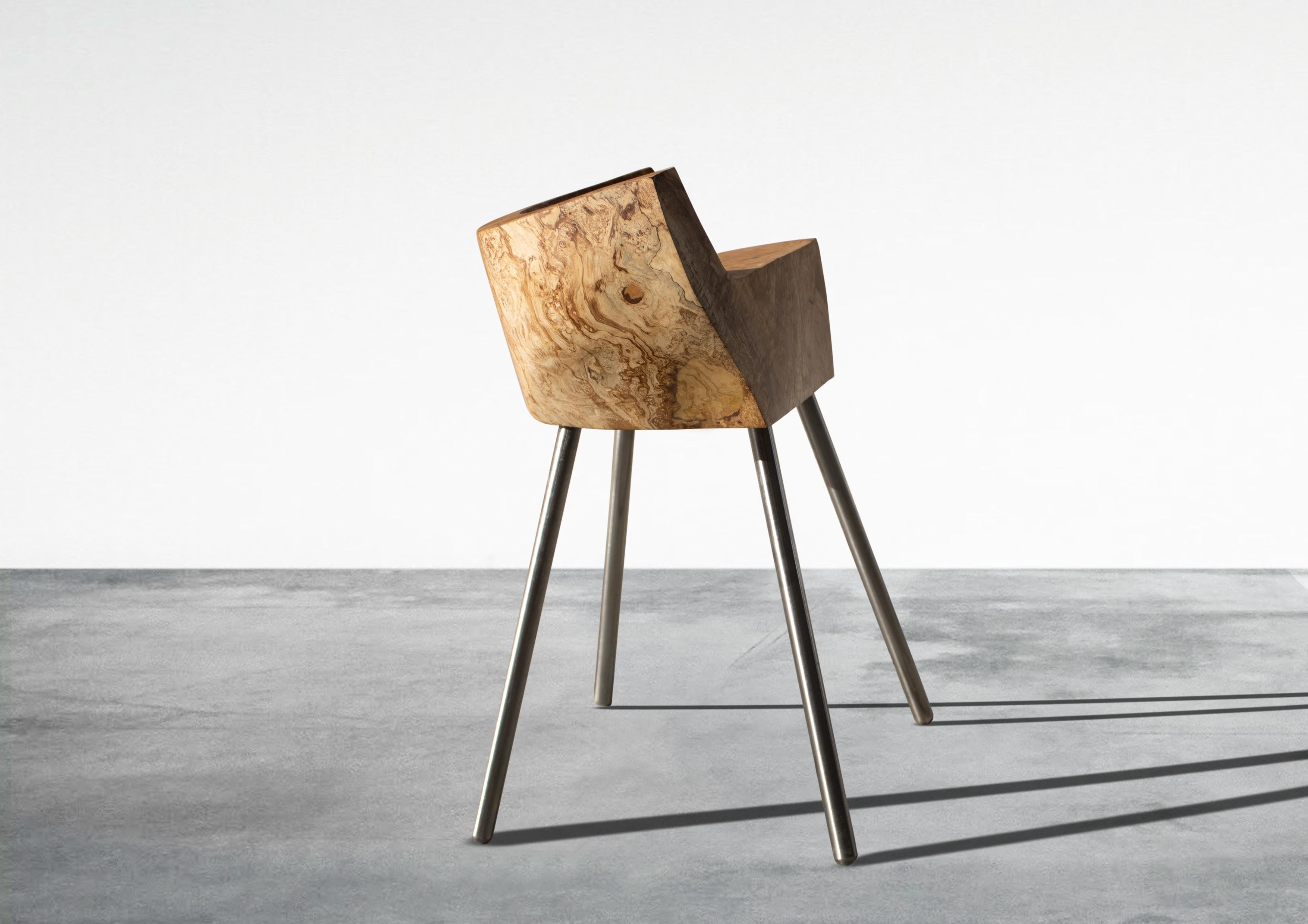 Minos armchair by Woody Fidler
Materials: Olive wood
Dimensions: W 38 x D 25 x H 56 cm
Seat width 28.5 cm
Seat depth 16 cm

Woody Fidler feels honored to live in a country where olive growing dates back to 4000 BC, as documented in Minoan