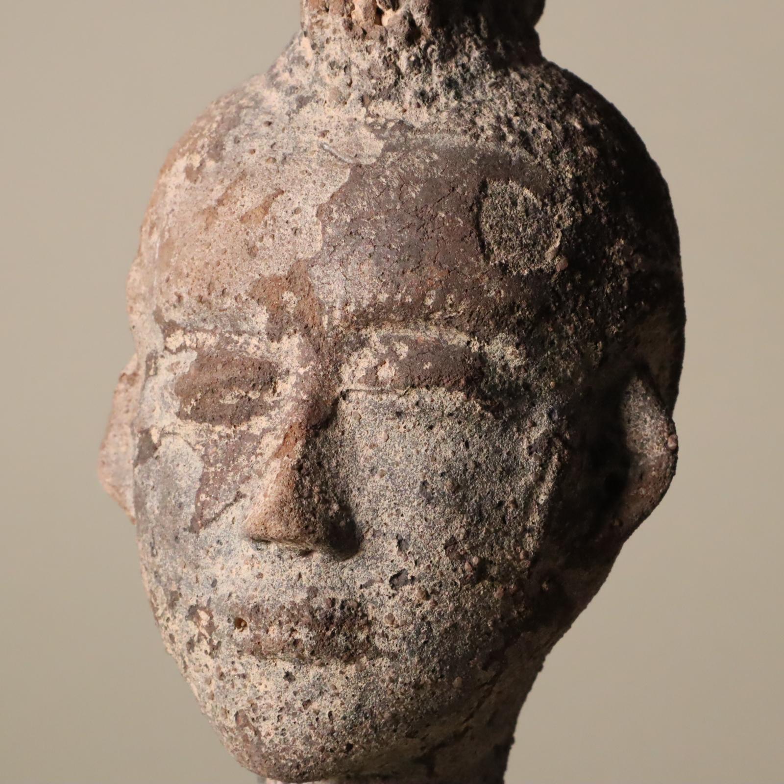 Store closing March 31. Full of character with an extraordinary hairdo, this is an earthenware or terracotta portrait from the Akan people of Ghana, 19th century or earlier.
This has a terrific crested coiffure. The facial features set in a