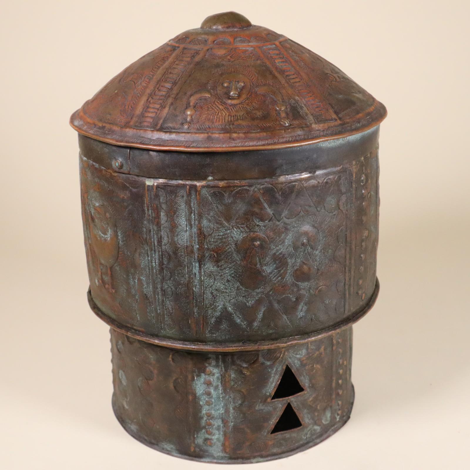 Fine repousse and cut sheet brass or bronze lidded treasure box from the Akan people of Ghana, West Africa, 20th century. Images include human figures, sandals, swords, and animals. These images relate to traditional Akan proverbs and symbolism.