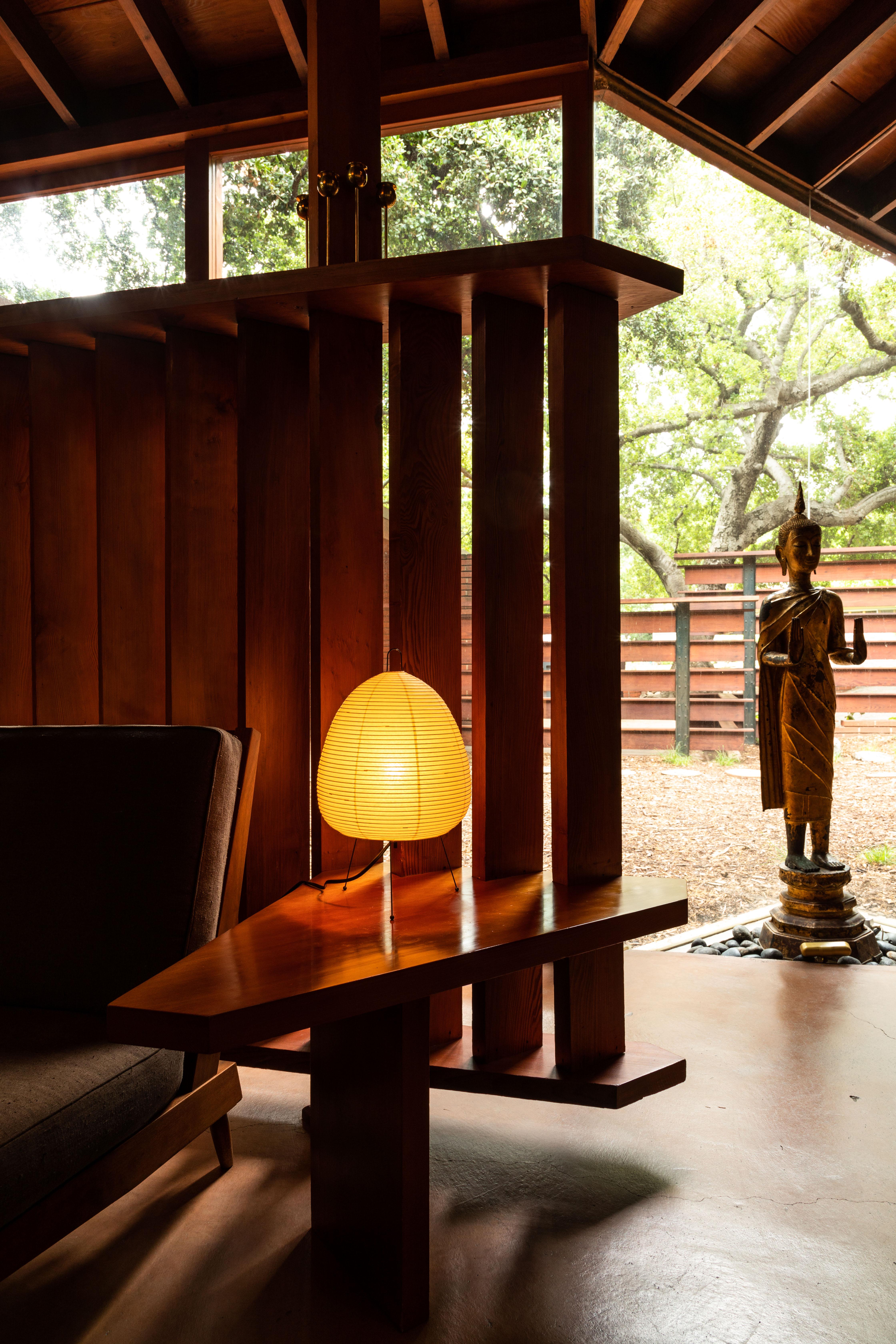 Akari model 1A light sculpture by Isamu Noguchi. The shade is made from handmade washi paper and bamboo ribs with Noguchi Akari manufacturer's stamp. Akari light sculptures by Isamu Noguchi are considered icons of 1950s modern design. Designed by