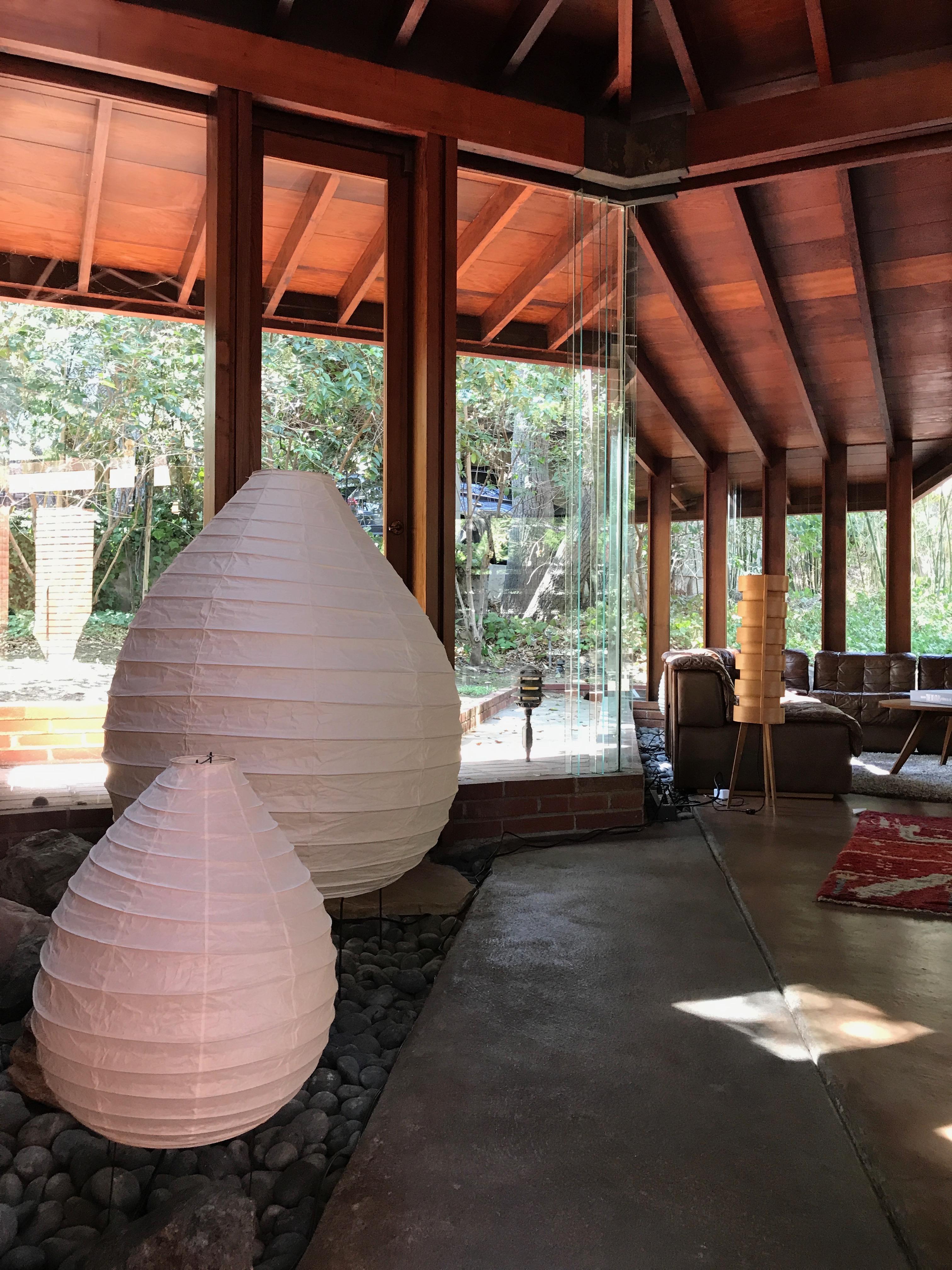 Akari model 22N light sculpture by Isamu Noguchi. The shade is made from handmade washi paper and bamboo ribs with Noguchi Akari manufacturer's stamp. Akari light sculptures by Isamu Noguchi are considered icons of 1950s modern design. Designed by