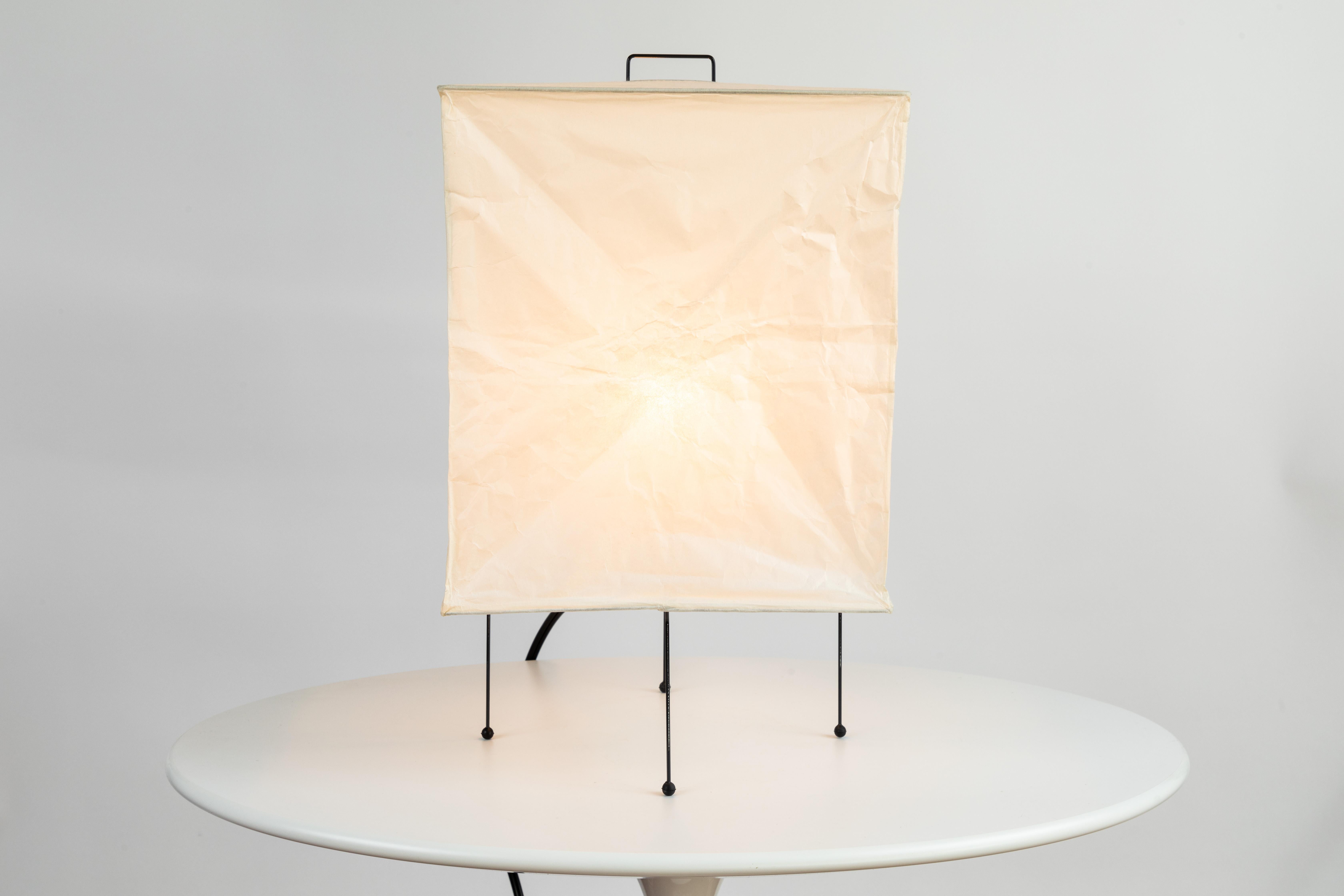 Akari model XP1 light sculpture by Isamu Noguchi. The shade is made from handmade washi paper and bamboo ribs with Noguchi Akari manufacturer's stamp. Akari light sculptures by Isamu Noguchi are considered icons of 1950s modern design. Designed by