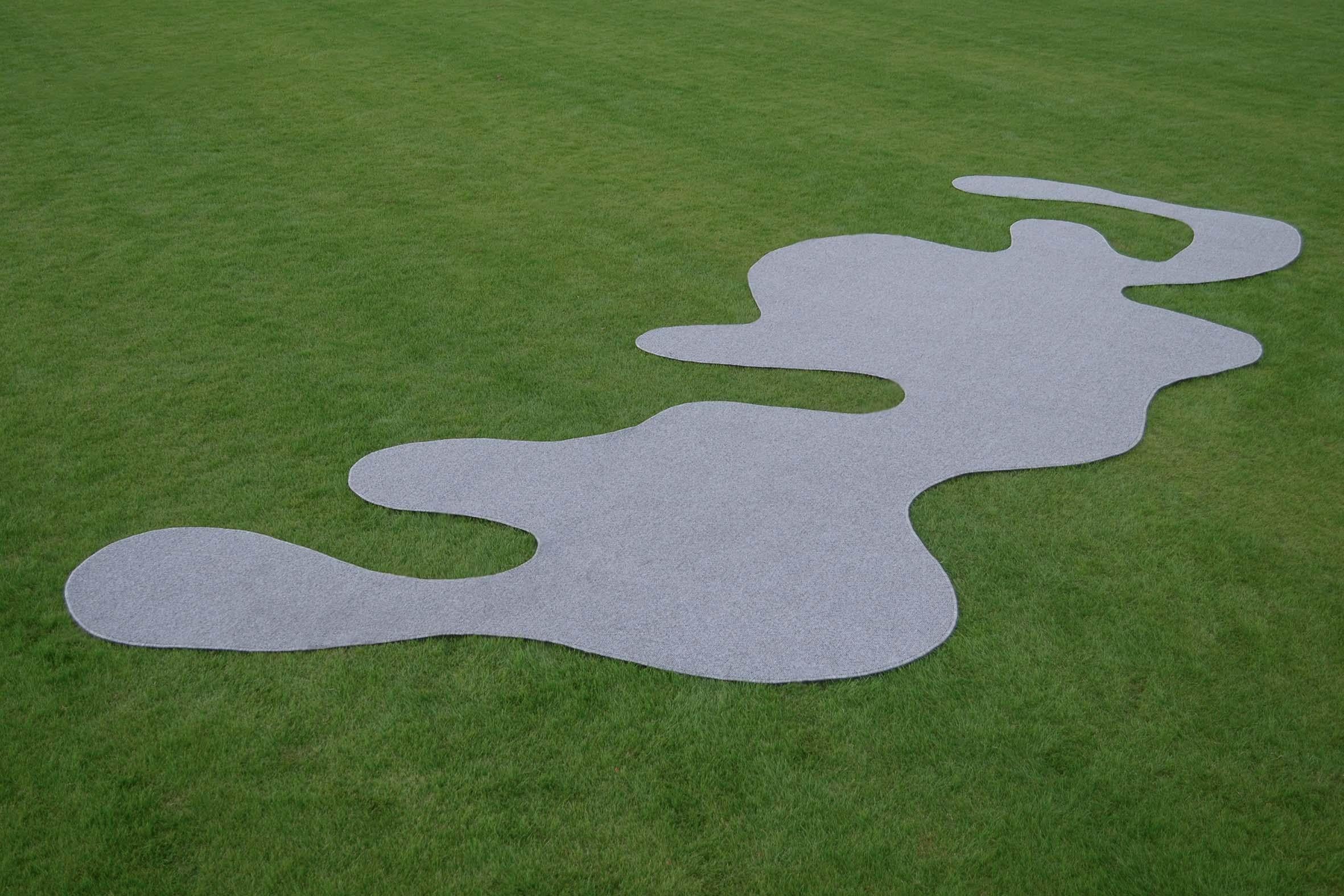 Aki Rug A by Studio Christinekalia
Dimensions: W 350 x D 700 x H 1.5 cm.
Materials: Artificial Wool, Felt. 

Christine Kalia is a design studio exploring modes of spatial relations between architectural, interior and product design. The studio’s