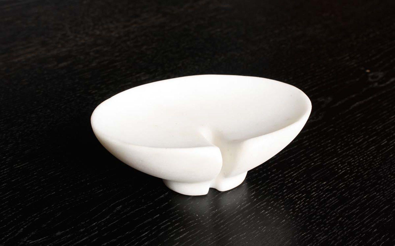 These hand-carved marble soap dishes are crafted by traditional artisans in Rajasthan State, India. Their shape derives from lily pads, and they drain excellently, sparing one's soap from getting soggy. Hand-made, so individual items may vary subtly