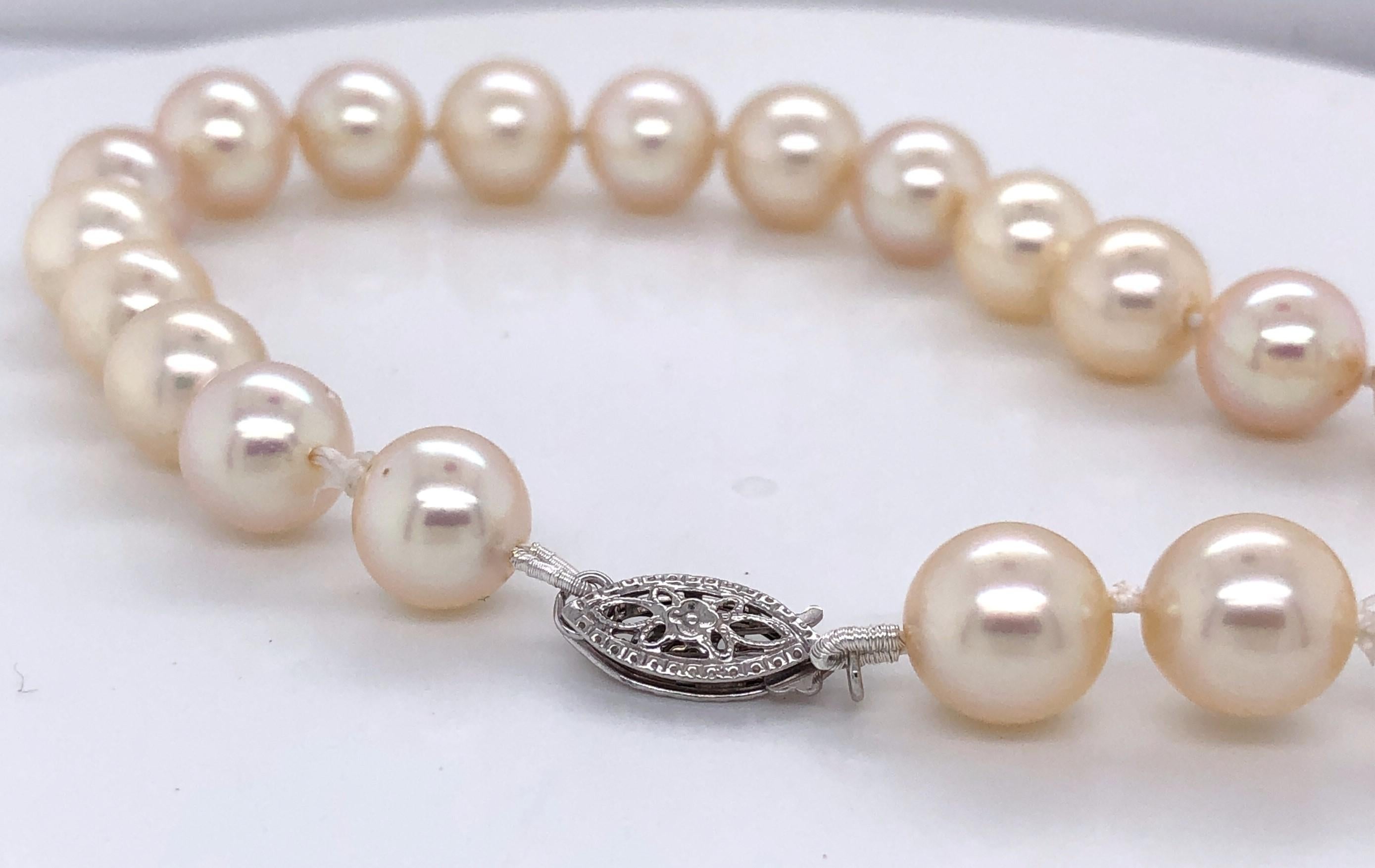 One bracelet knot strung with twenty-two 8mm cultured Akoya pearls.  The bracelet measures 8.25 inches long and has a traditional 14 karat white gold filigree clasp. 