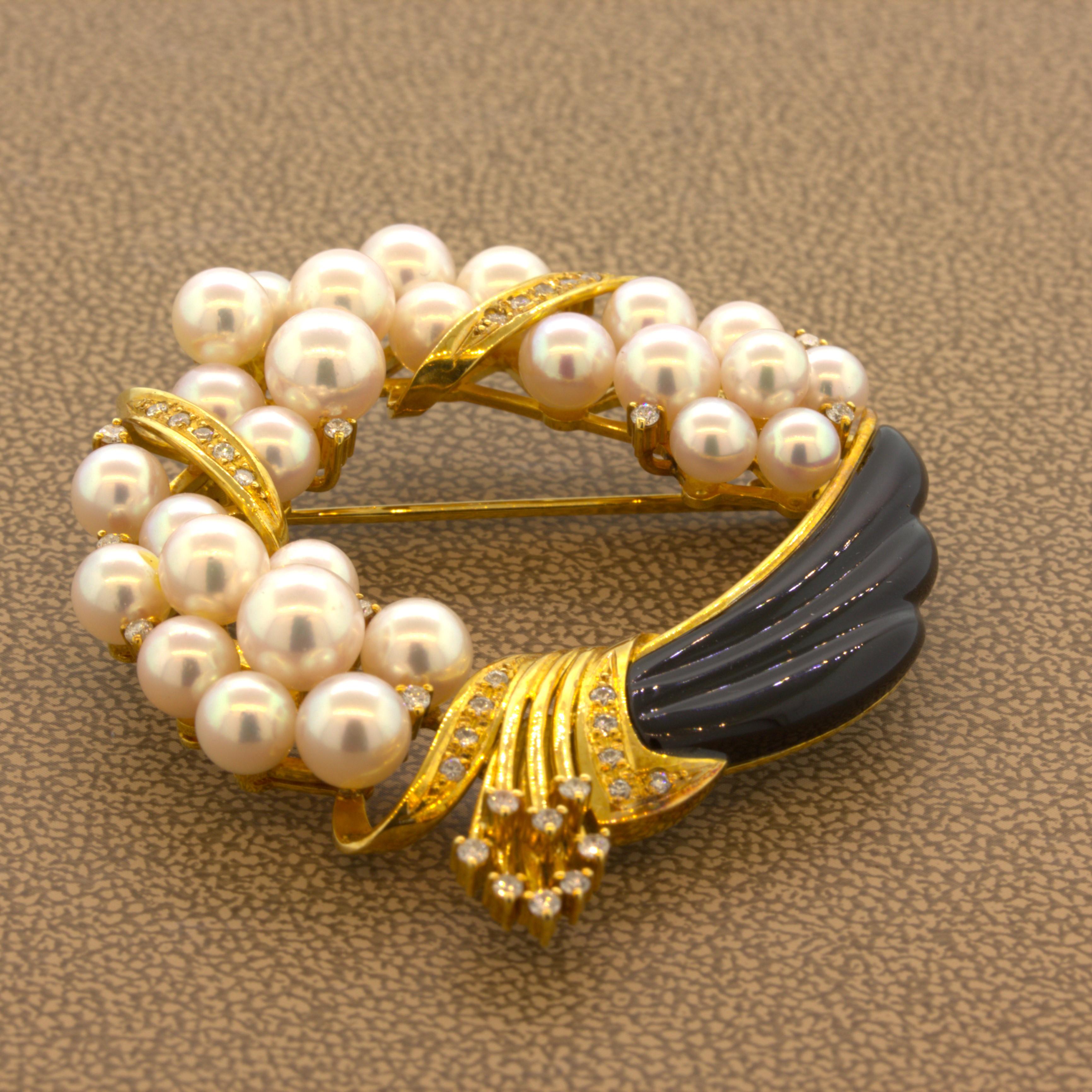 A chic and elegant brooch featuring a plethora of fine AAA Akoya pearls. The pearls measure 5mm x 6.5mm in diameter and are of the finest quality. Each pearl is perfectly rounded with high luster and a super strong pink overtone that makes the