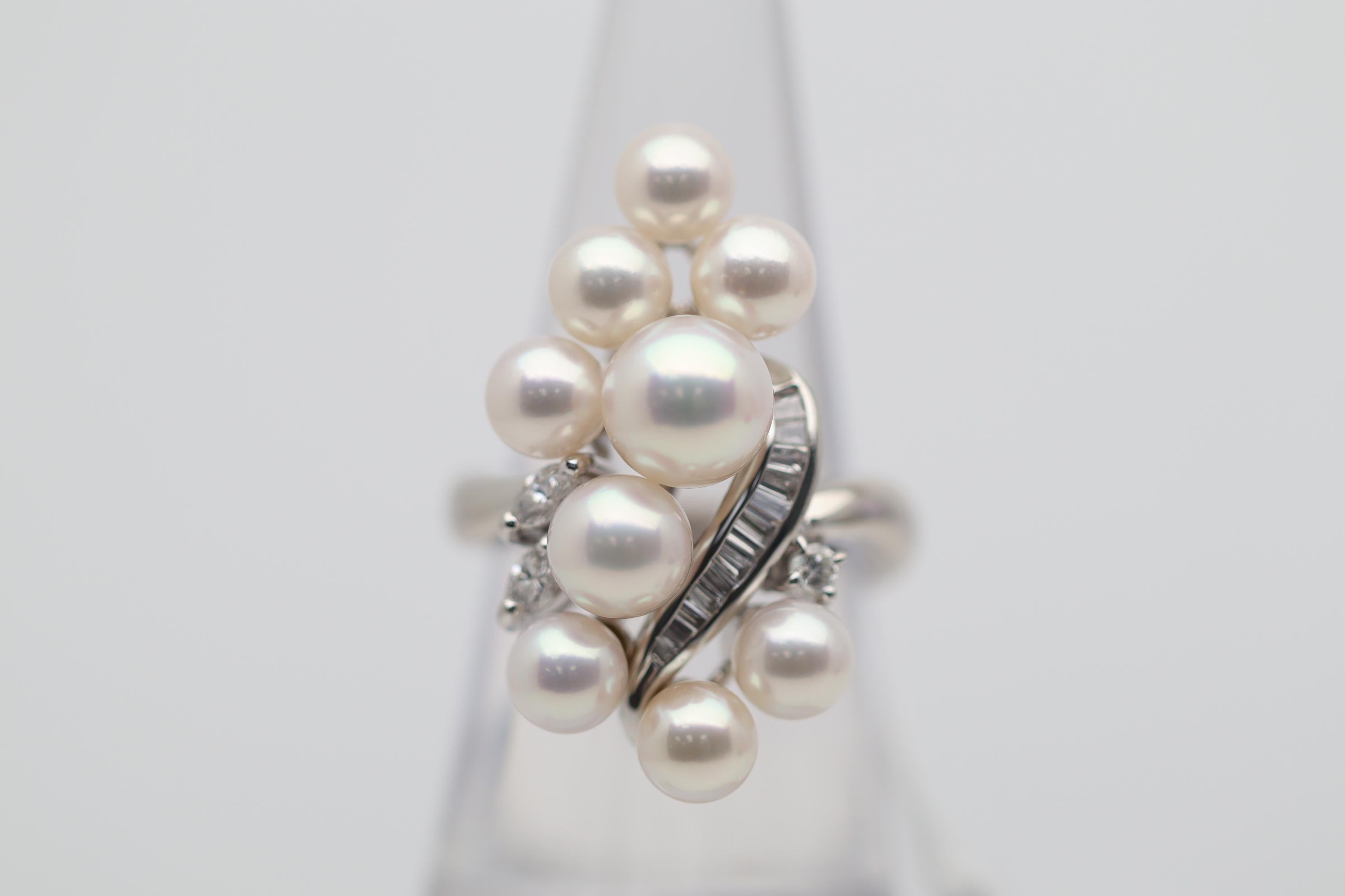 A stylish and chic platinum ring featuring 9 fine gem quality Akoya pearls. They range in size from 5.5mm – 8mm while each has excellent nacre quality, luster, and a strong pink overtone that glows in the light. They are complemented by 0.41 carats