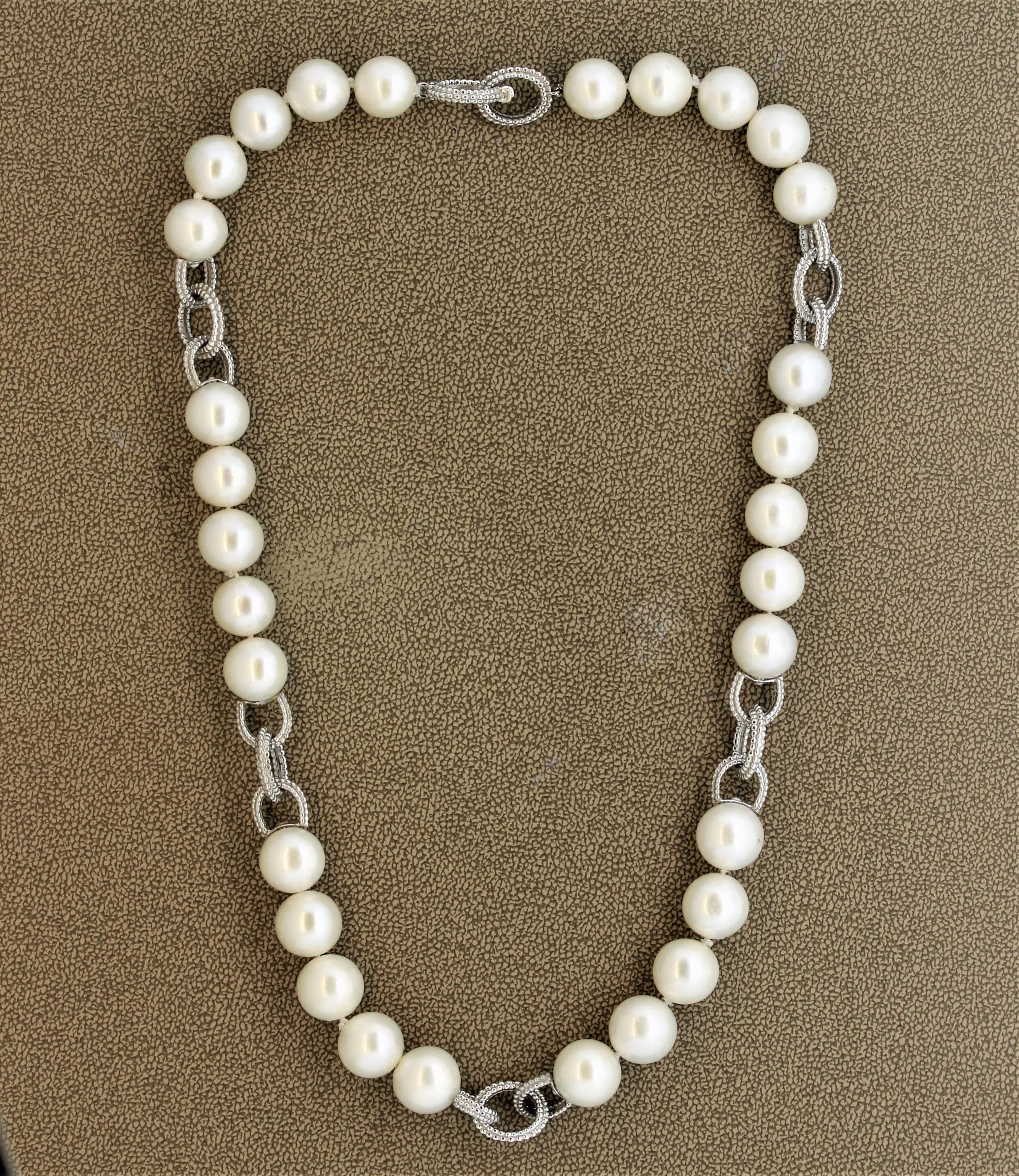 Here we have a modern take of a traditional pearl strand. There are a total of 30 round Akoya pearls separated 5 at a time with white gold hoop-links. The pearls measure 10.5 – 11.0 millimeters each.

Length: 18 inches