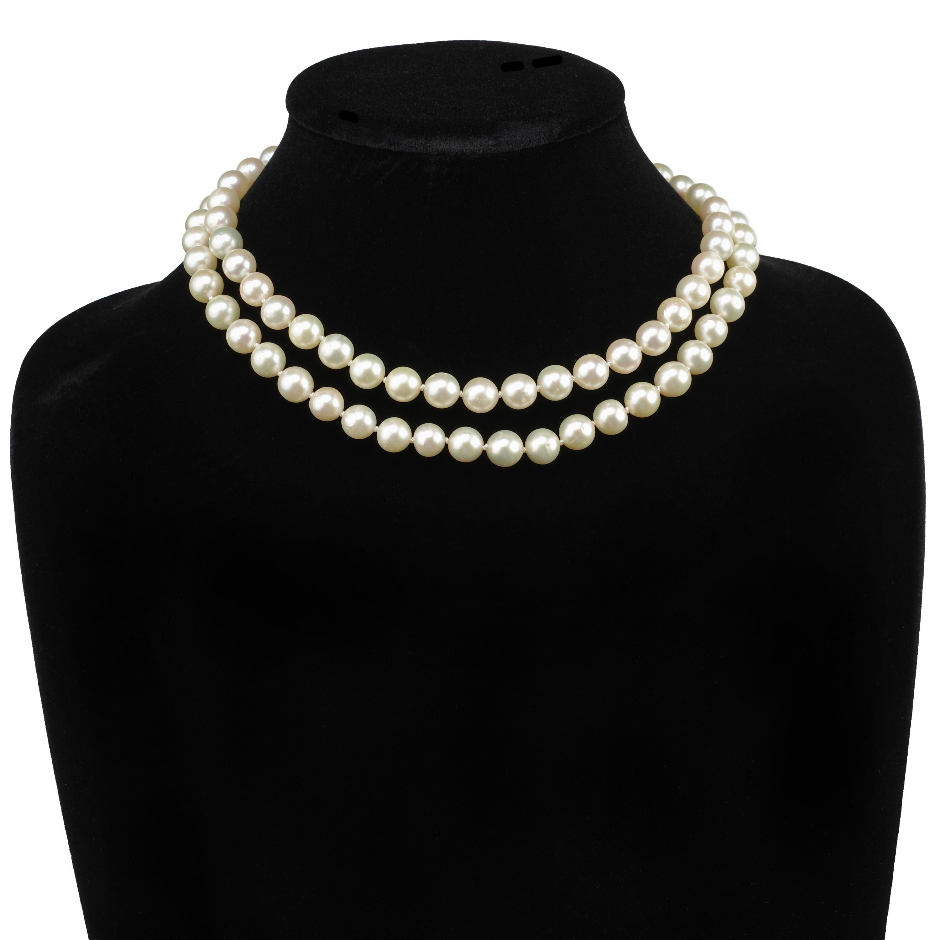 This double strand of cultured Akoya pearls was created in the 1950s and features exceptionally large —9.00-9.40mm— pearls with thick, luscious nacre. The pearls are light cream with rose overtones. The silver clasp features an 8.5mm pearl