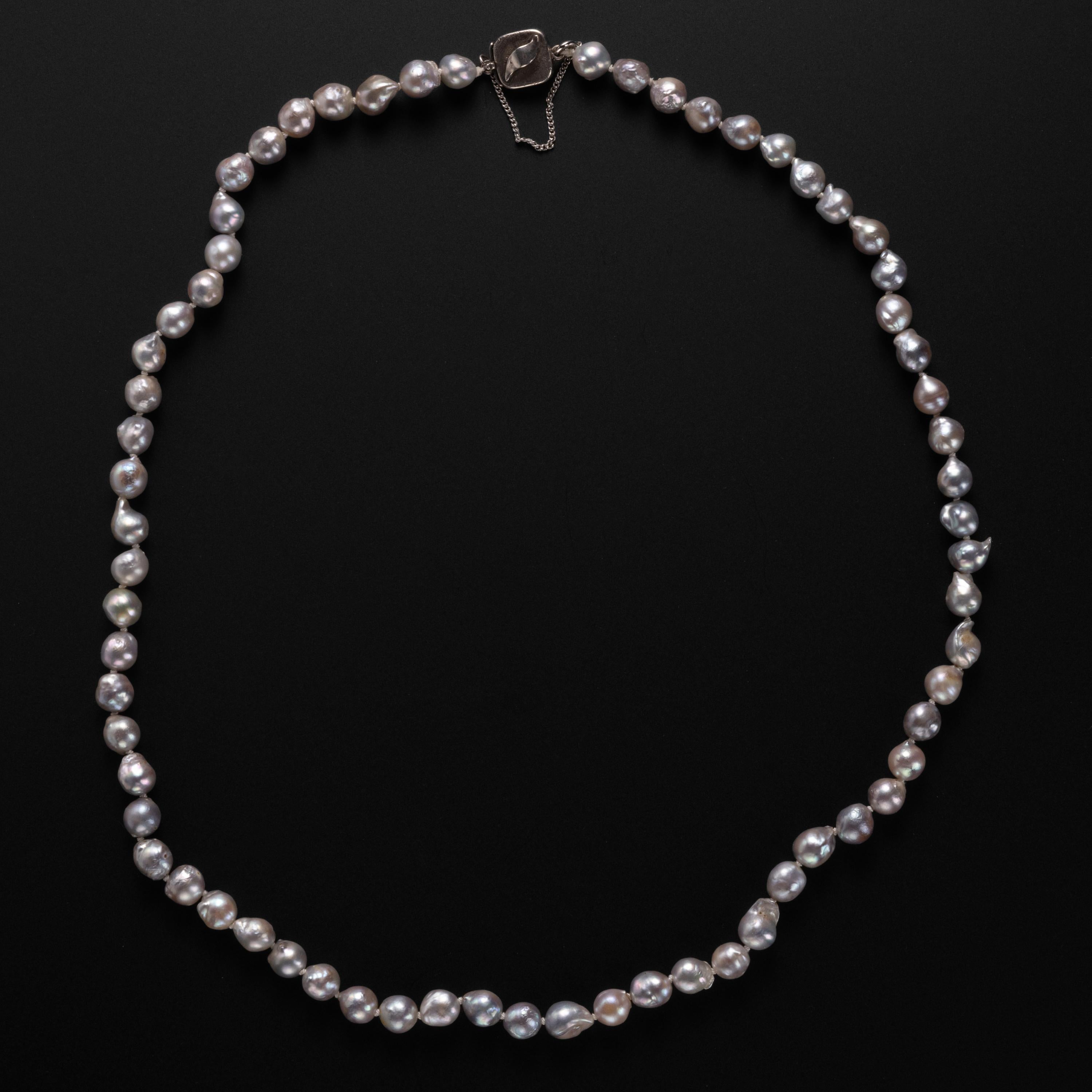 This circa 1970s necklace of silvery-blue cultured baroque Akoya pearls is a gorgeous and unique vintage treasure. These magnificent pearls possess a bright, high luster with a dimpled, rippled surface that makes them undulate with luminous beauty.