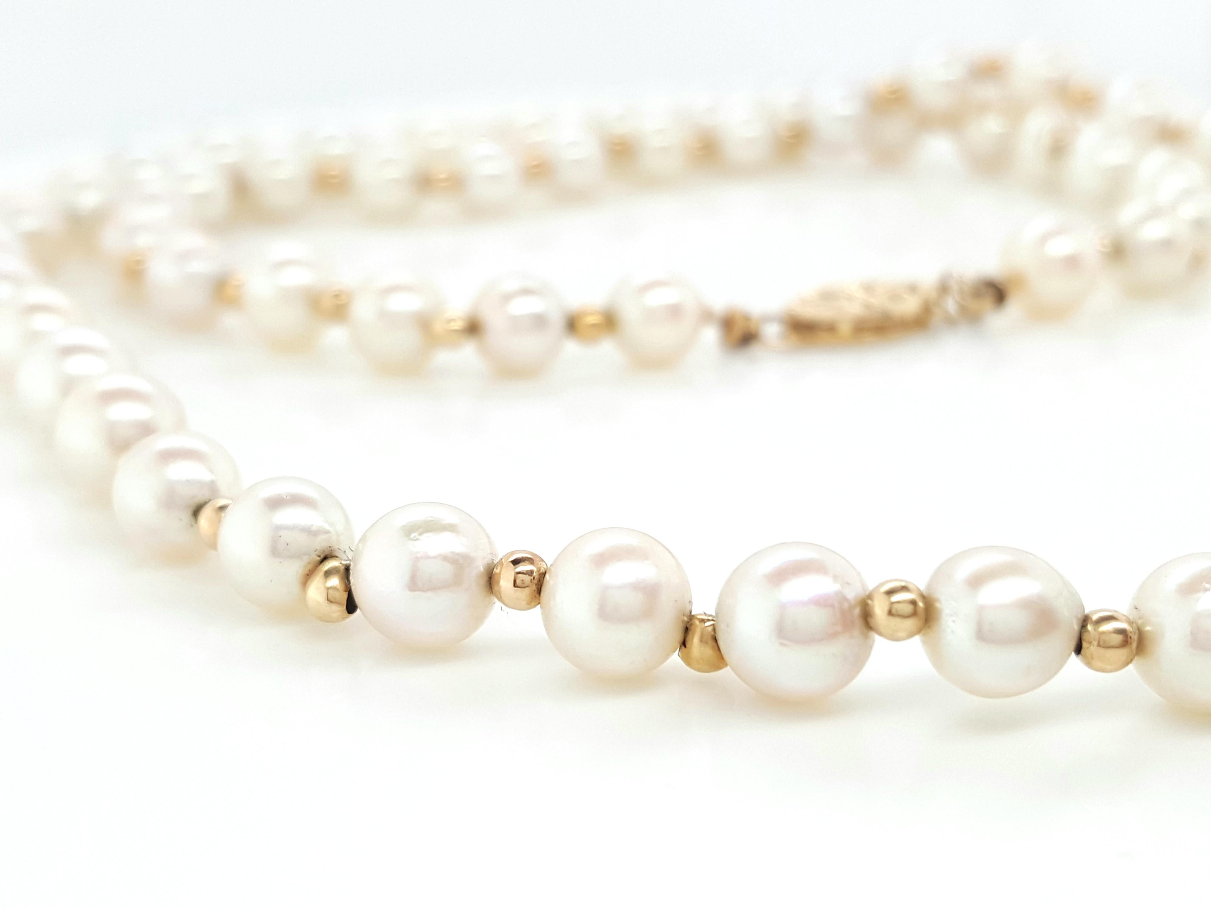 Akoya Pearl Strand Accented by 14K Yellow Gold Beads   This necklace is made of sixty pearls measuring from 5.46 - 5.88 mm alternating with 14 karat yellow gold beads and finished with a 14 karat yellow gold marquise shaped pearl clasp.  The strand