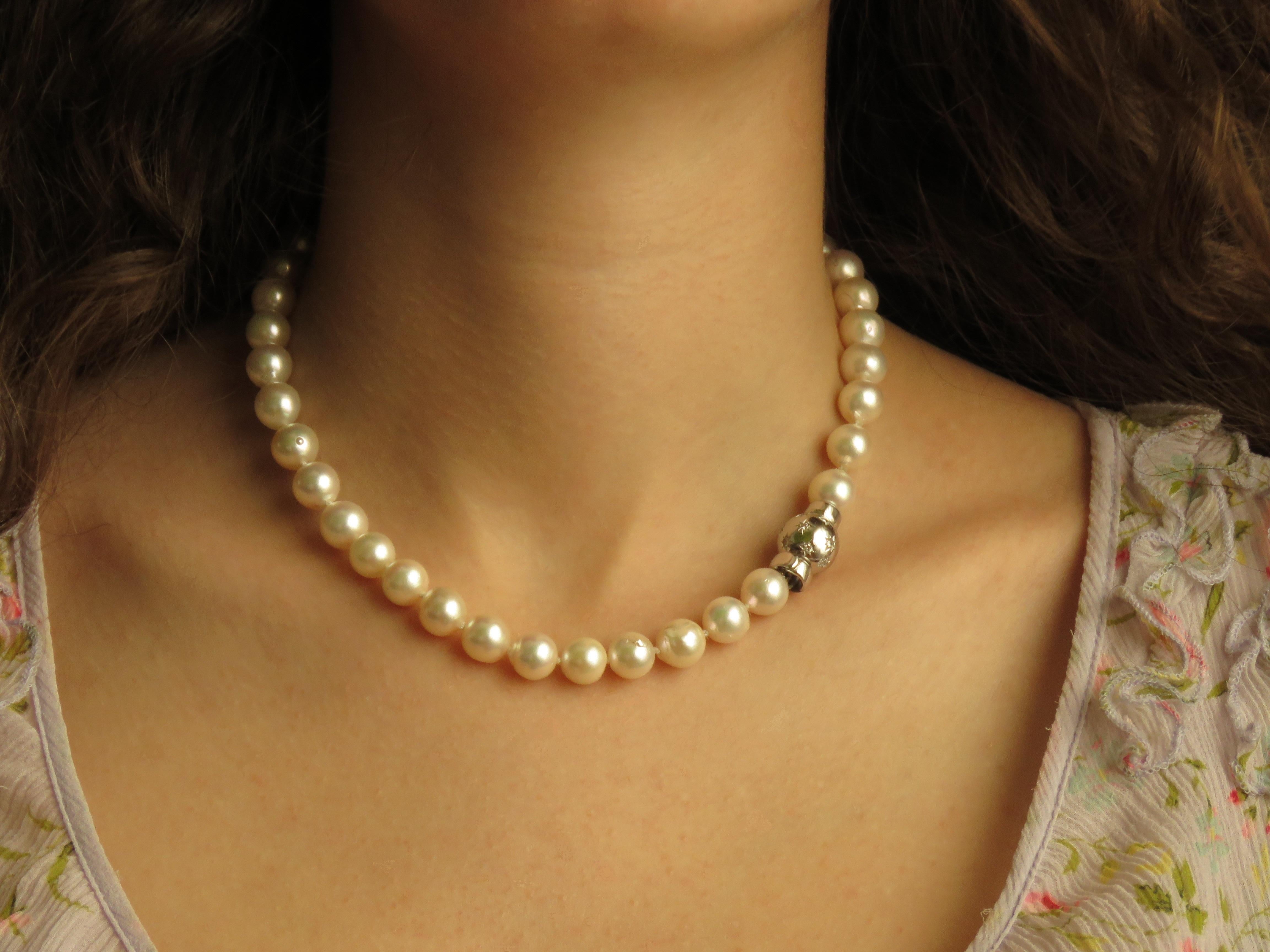 Genuine strand of Japanese Akoya pearls necklace with sphere clasp in 18 karat white gold with brilliant cut white diamonds. The necklace is marked with the Italian Gold Mark 750 and Botta Gioielli brandmark 716MI.

Crafted: in 18 karat white