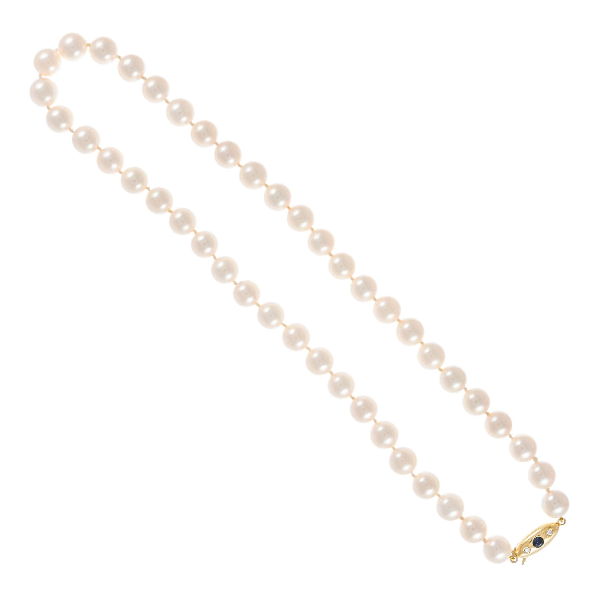 Japanese Akoya cultured pearl 16.5 Inch necklace. 8-8.25 millimeter white pearls with rose overtones. Excellent luster. 18k yellow gold clasp with one round sapphire and two round brilliant cut diamonds.

44 cultured white/rose hue pearls, 8-8.5mm
1