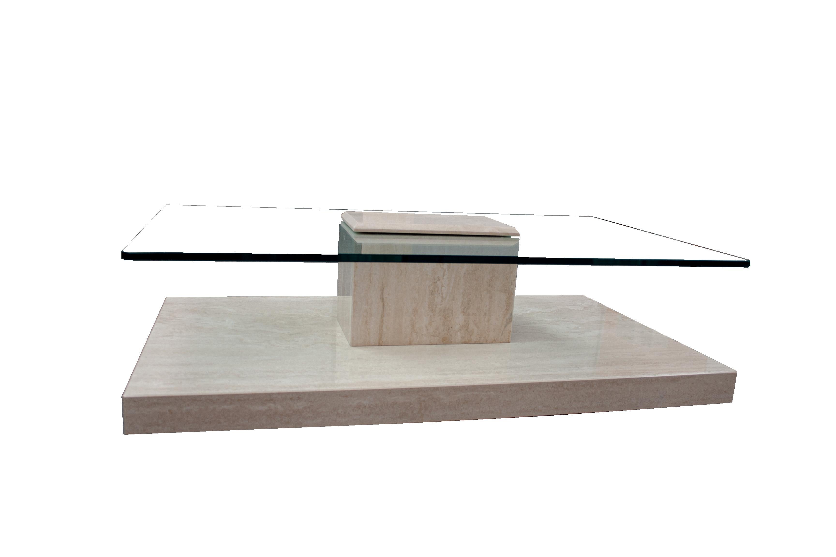 AKRA Travertine Marble & Glass Coffee Table Contemporary Design Spain In Stock.
This coffee table in polished travertine marble with glass has a very particular design, having a part of the marble that covers the glass on the surface and joins it