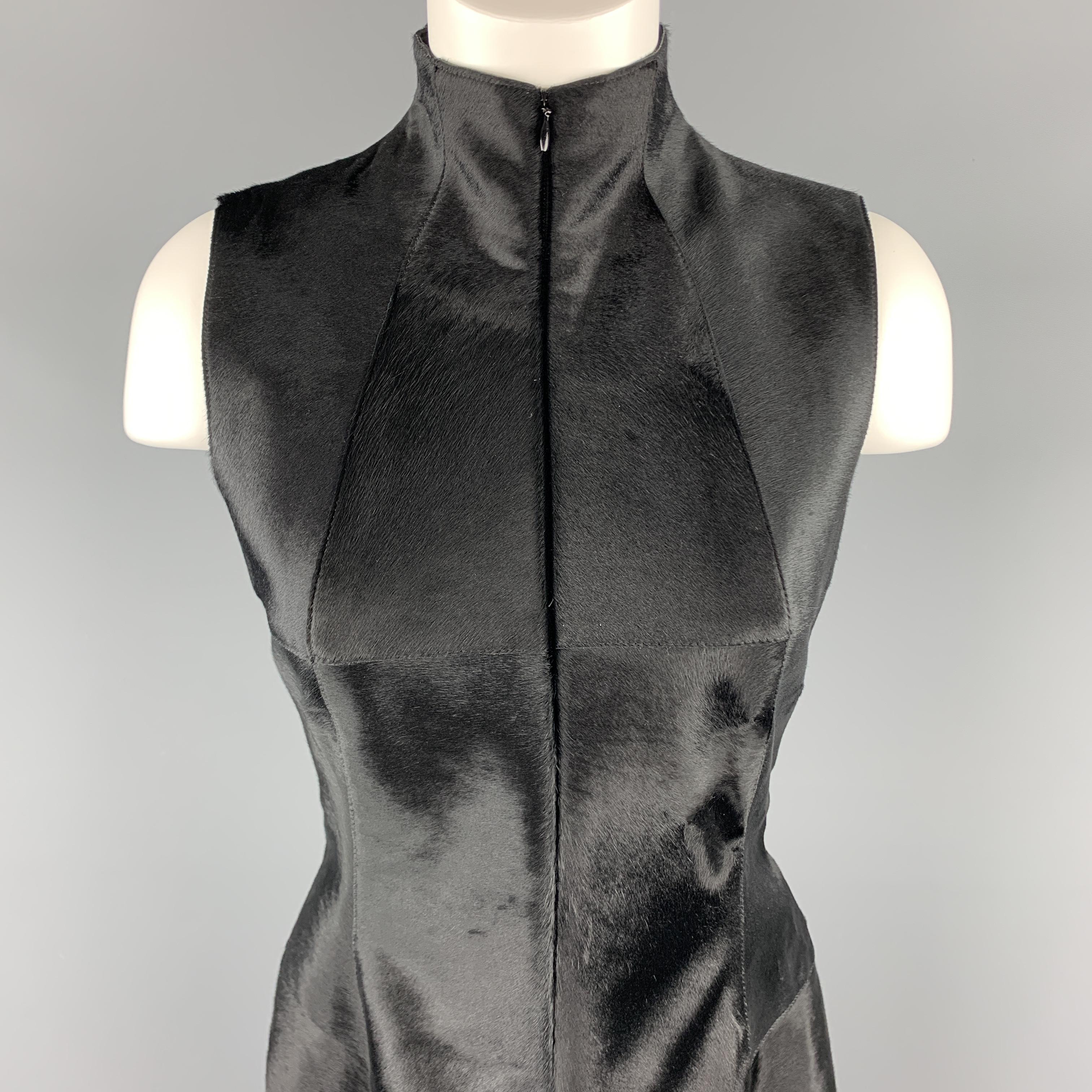 This gorgeous AKRIS shift dress comes in black pony hair leather with a high mock neck, hidden zip front, A line skirt, and stripe panel back with silk chiffon inset box pleats.

Excellent Pre-Owned Condition.
Marked: US 6

Measurements:

Shoulder: