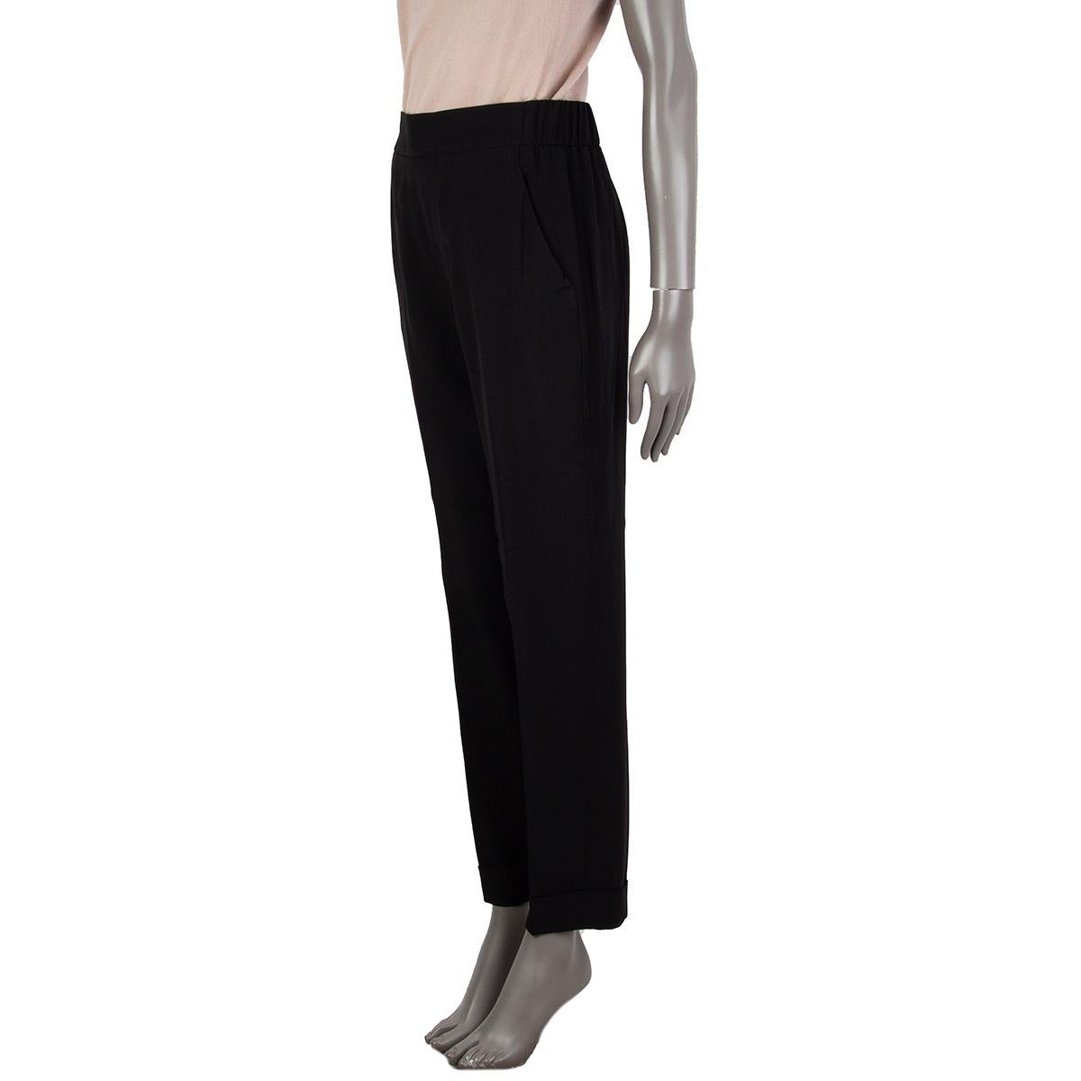 100% authentic Akris tapered pants in black acetate (52%) viscose (48%) with an elastic stretch-waistband in the back, slit-pockets on both sides, casual fit to slip on. Unlined. Has been worn and is in excellent condition. 

Measurements
Tag