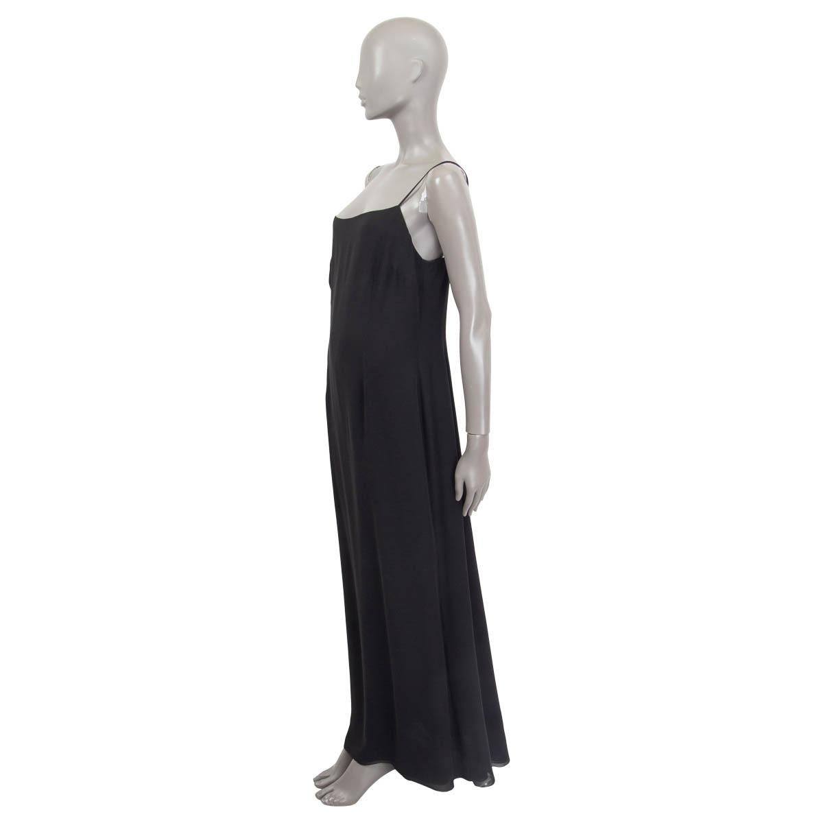 100% authentic Akris sleeveless evening dress in black silk (100%). Opens with a concealed zipper and a hook on the back. Lined in black silk (100%). Has a drawn thread at the bottom of the dress, otherwise in excellent condition. 

Measurements
Tag
