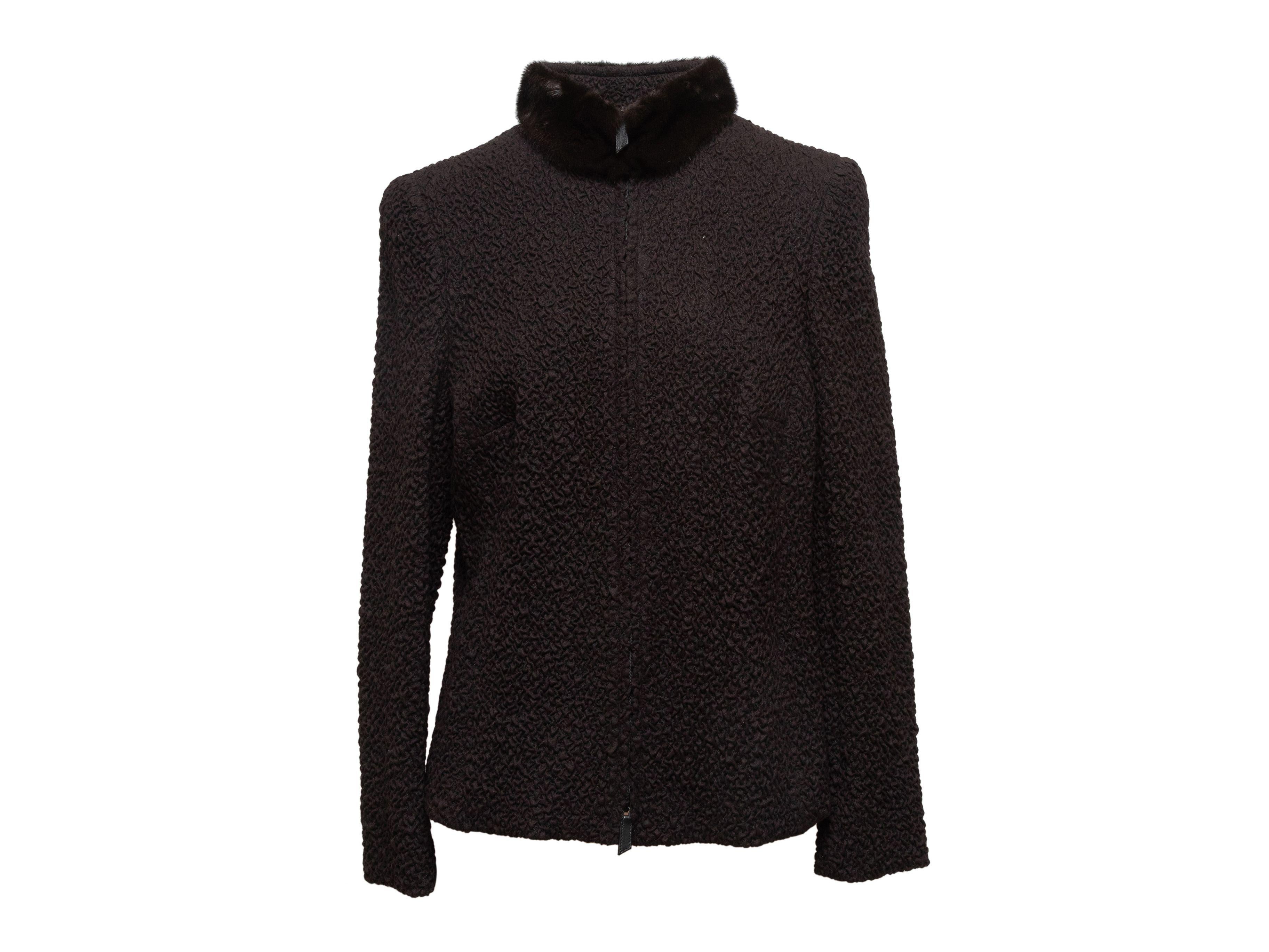 Product Details: Dark brown wool jacket by Akris. Mink fur trim at collar. Zip closure at center front. 34