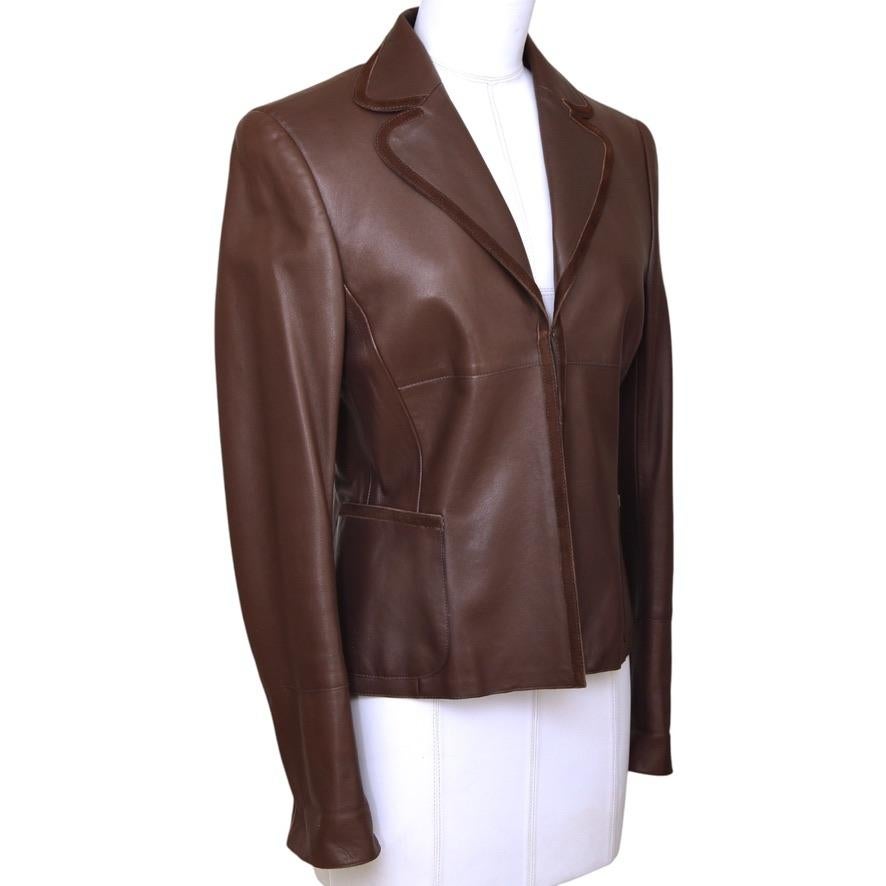 GUARANTEED AUTHENTIC AKRIS BROWN LEATHER JACKET

Details:
 - Lambskin leather blazer style jacket jacket in a rich brown color.
 - Brown suede trim.
 - Open at front with single hook-n-eye closure.
 - Notch collar.
 - Long sleeve, cuffs can be