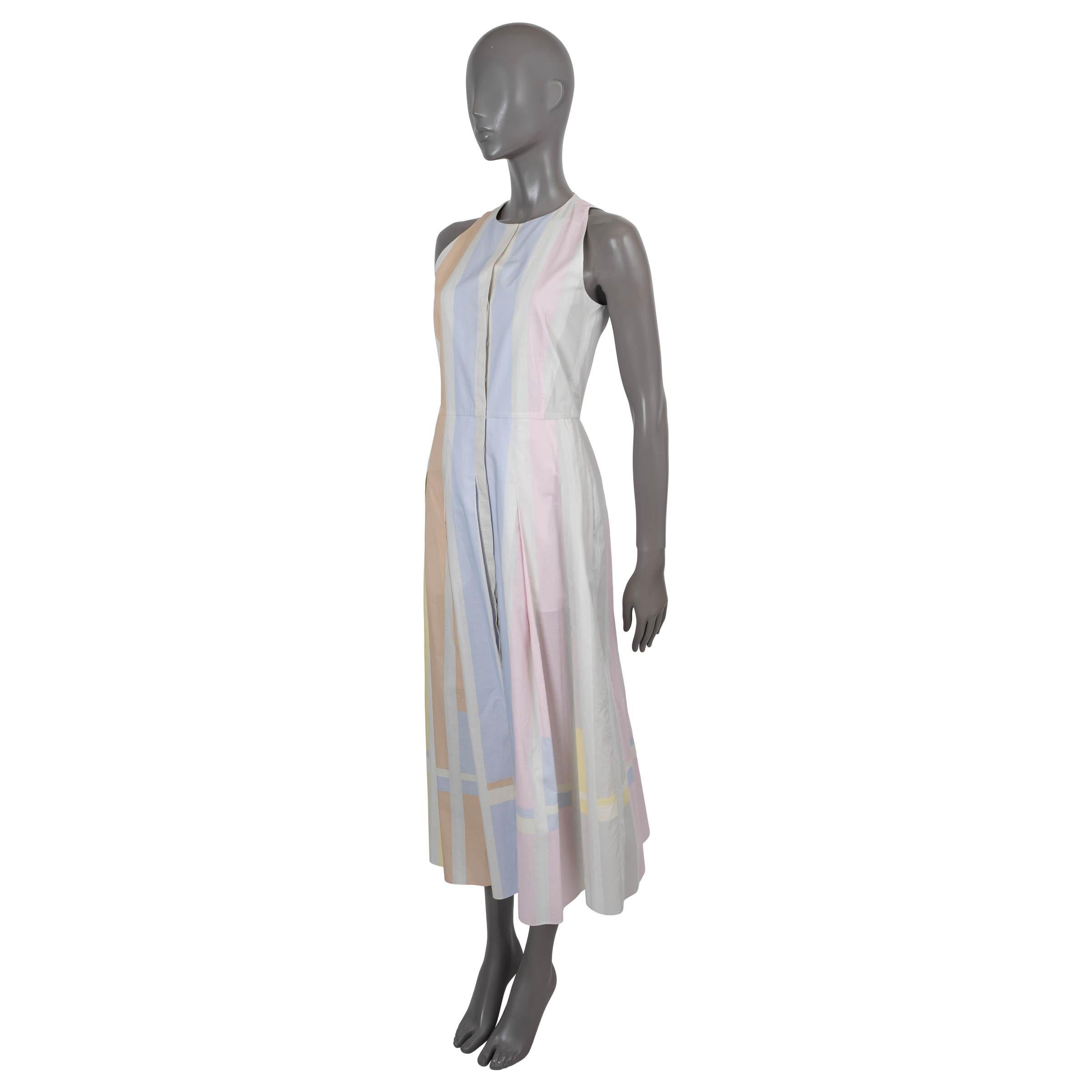 100% authentic Akris sleeveless midi dress in multicolor striped voile cotton (100%). Features a tailored top with round neck and a pleated skirt. Opens with concealed buttons on the front and is lined in cupro (100%).Has been worn and is in