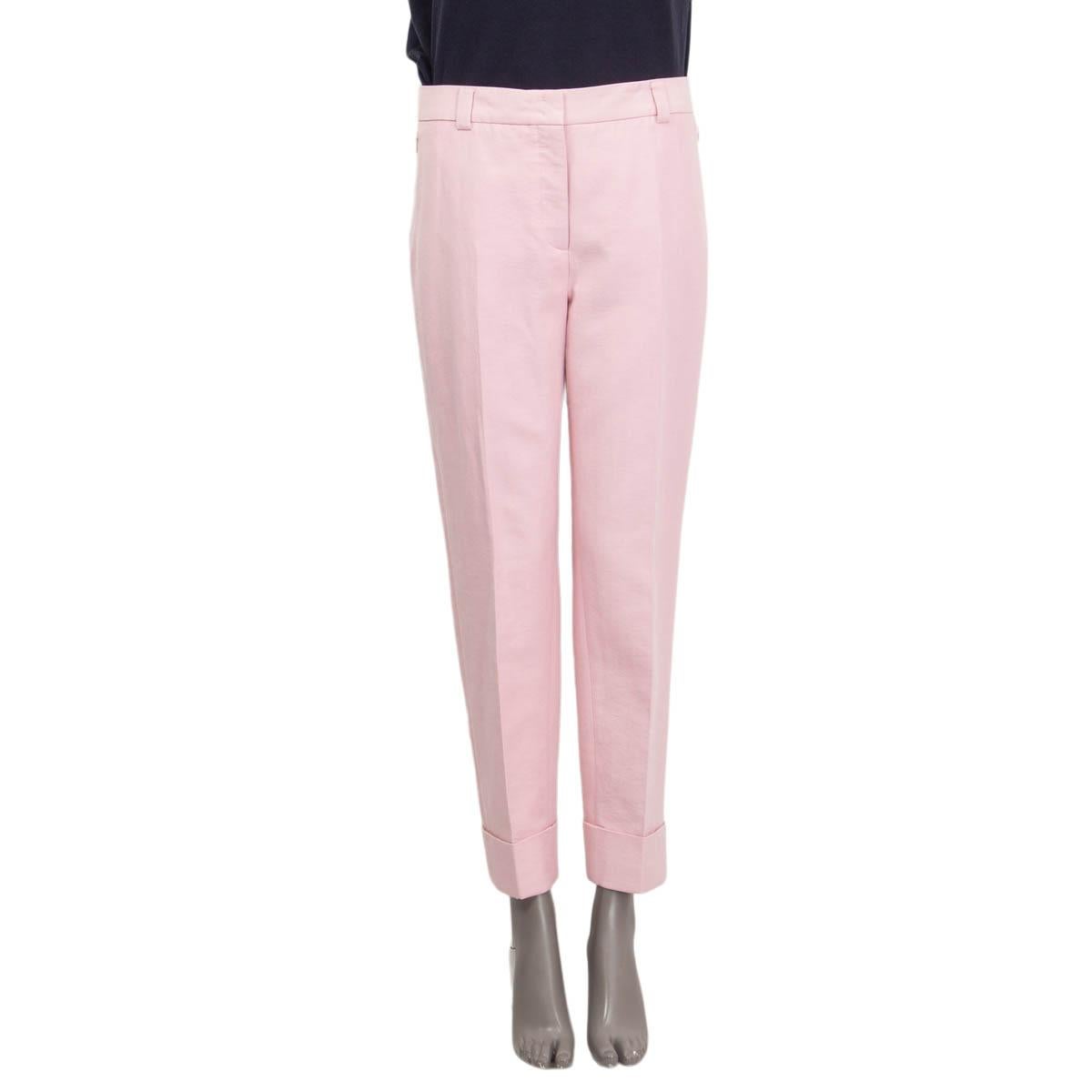100% authentic Akris classic cuffed pants in Lilola (pink) cotton (59%), silk (39%) and nylon (2%). Cruise 2021 collection. Features two zipped pockets on the side. Opens with a concealed zipper, two hooks and a button on the front. Have been worn