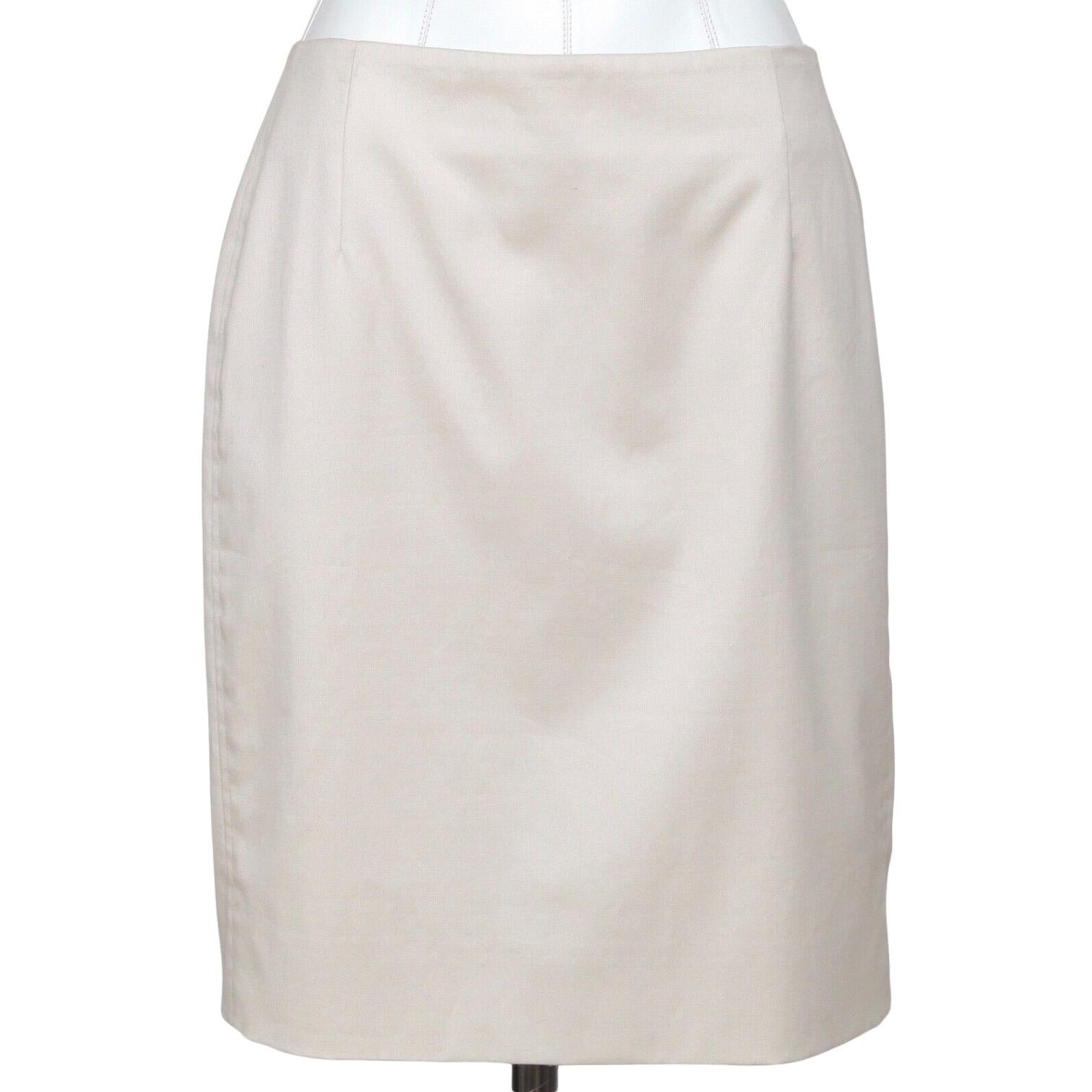 GUARANTEED AUTHENTIC AKRIS PUNTO BEIGE STRAIGHT KNEE LENGTH SKIRT

Design:
- Flat front
- Rear zipper and button closure
- Tonal stitching, darting.
- Fully lined.

Size: US 8, FR 40

Material: 97% Cotton, 3% Elastaine
Measurements:
- Waist: