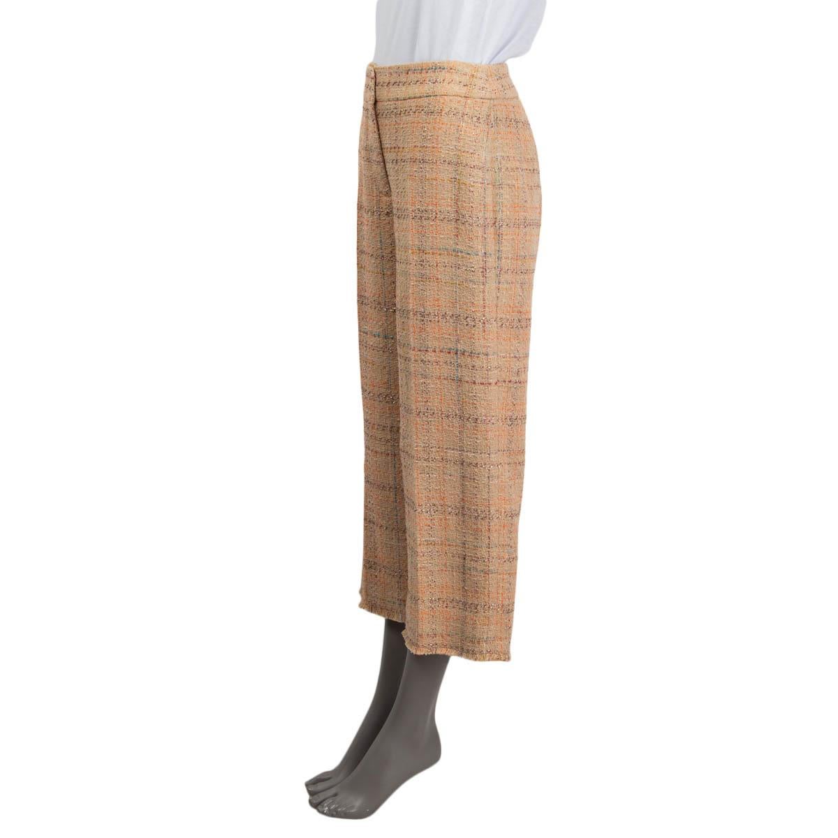 100% authentic AKRIS Punto cropped pants in camel, orange, turquoise and purple cotton (46%), polyester (37%), acrylic (13%), nylon (3%) and viscose (1%). Feature a high-waist silhouette and fringed cuffs. Close with a concealed zipper, a button and